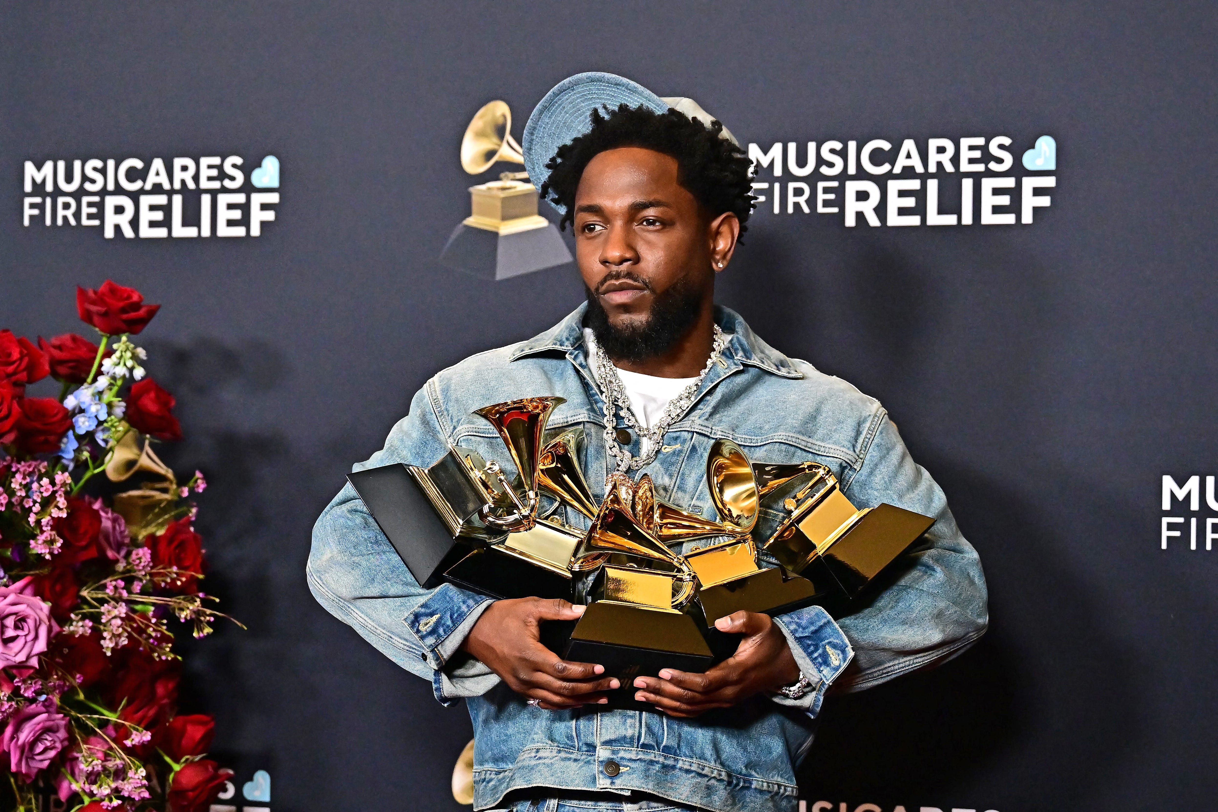Kendrick Lamar poses with his Grammy Awards in the press room during the 67th annual Grammy Awards at the Crypto.com Arena in Los Angeles on Feb. 2, 2025.
