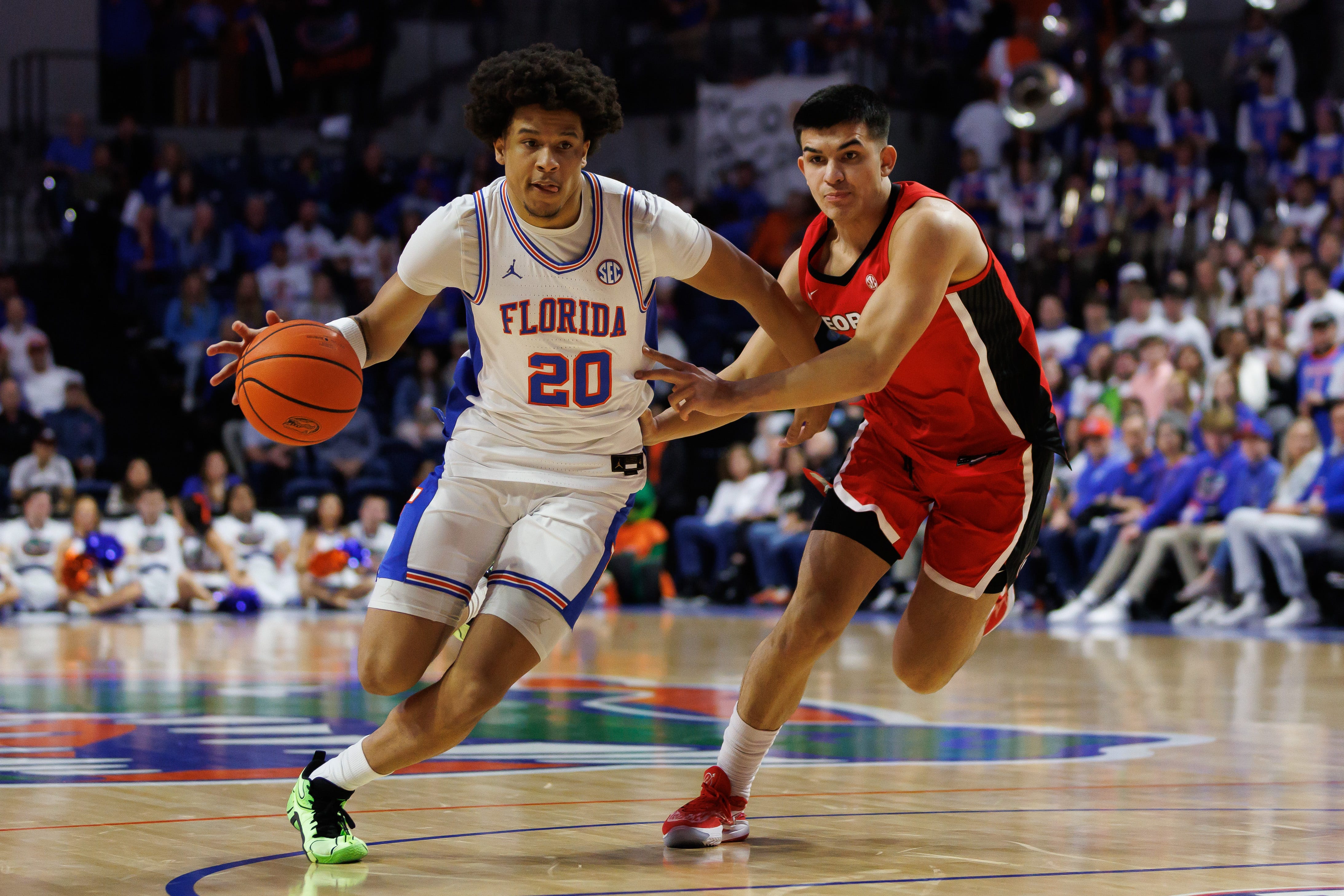 Florida guard Isaiah Brown (20) drives to the basket past Georgia guard Savo Drezgic (3) during the second half at Exactech Arena at the Stephen C. O'Connell Center.