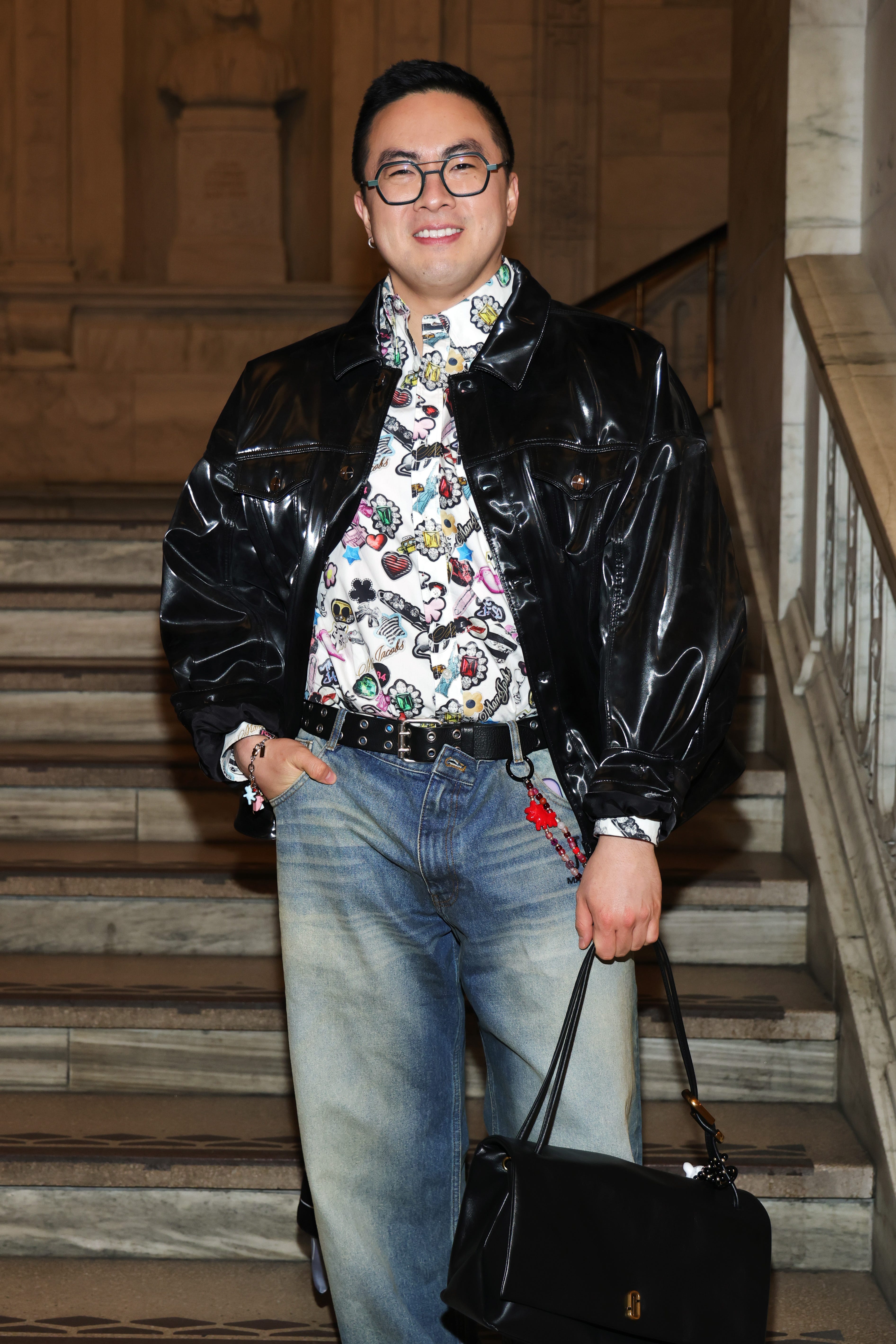 NEW YORK, NEW YORK - FEBRUARY 03: Bowen Yang attends the Marc Jacobs 2025 Runway Show at New York Public Library on February 03, 2025 in New York City. (Photo by Dimitrios Kambouris/Getty Images for Marc Jacobs)