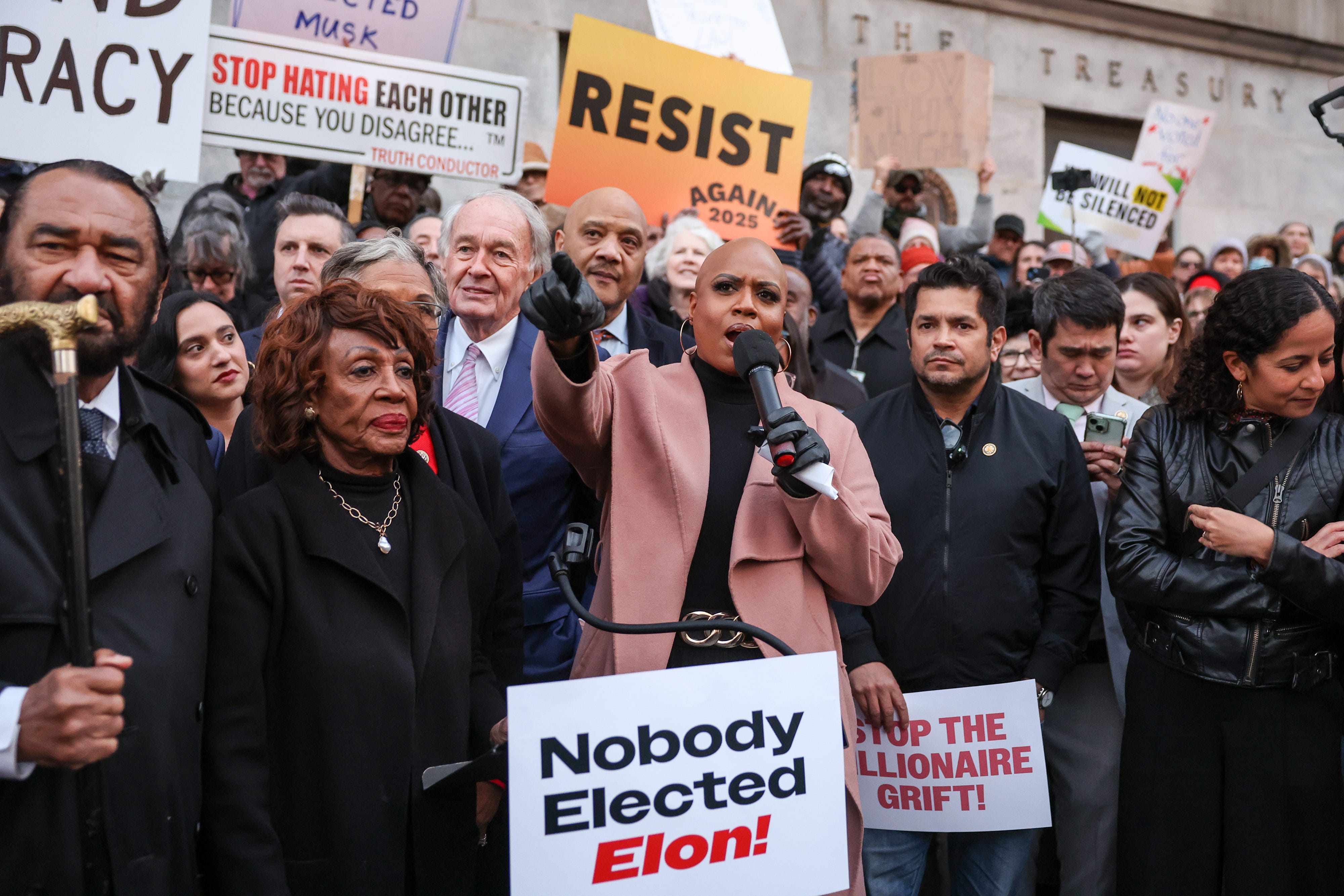 Rep. Ayanna Pressley, D-Mass., flanked by fellow Democratic members of Congress, addresses protesters at the U.S. Treasury Department on Feb. 04, 2025.