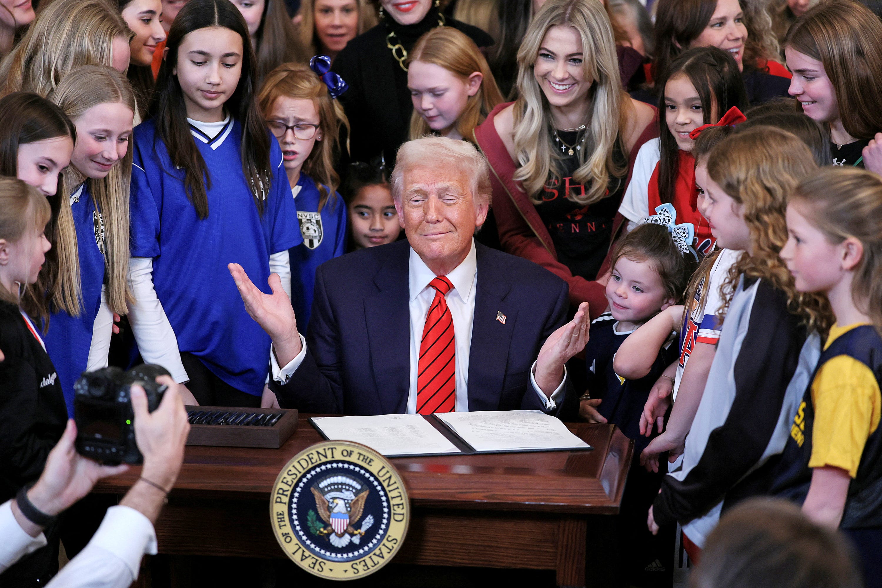 President Donald Trump signs an executive order at the White House on Feb. 5, 2025, banning transgender girls and women from participating in female sports.