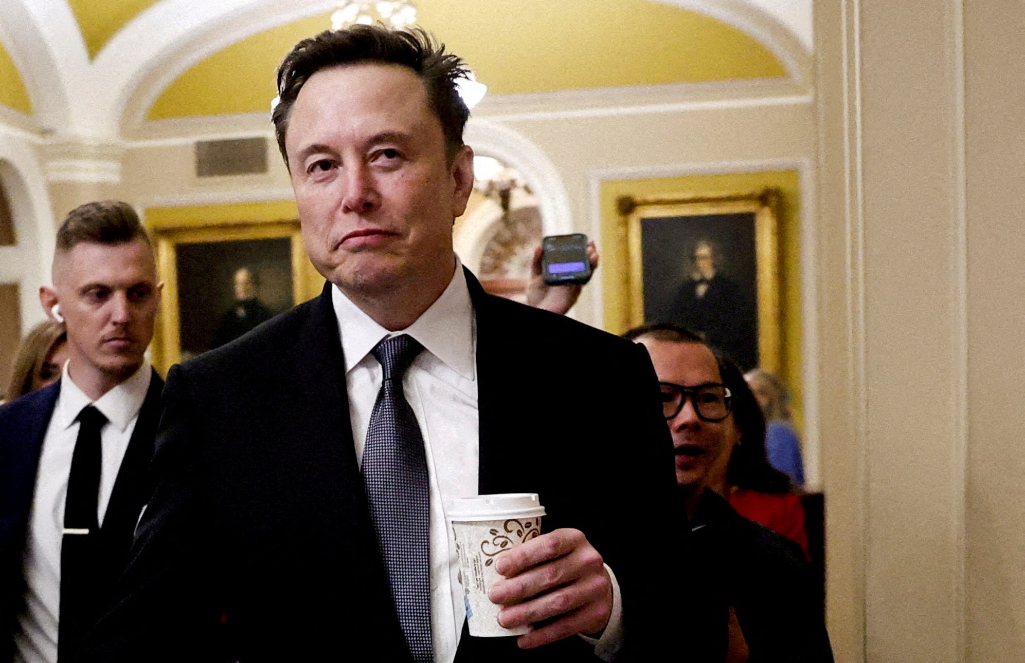 Elon Musk walks on Capitol Hill on the day of a meeting with Senate Republican Leader John Thune, R-S.D., in Washington, D.C., on Dec. 5, 2024.