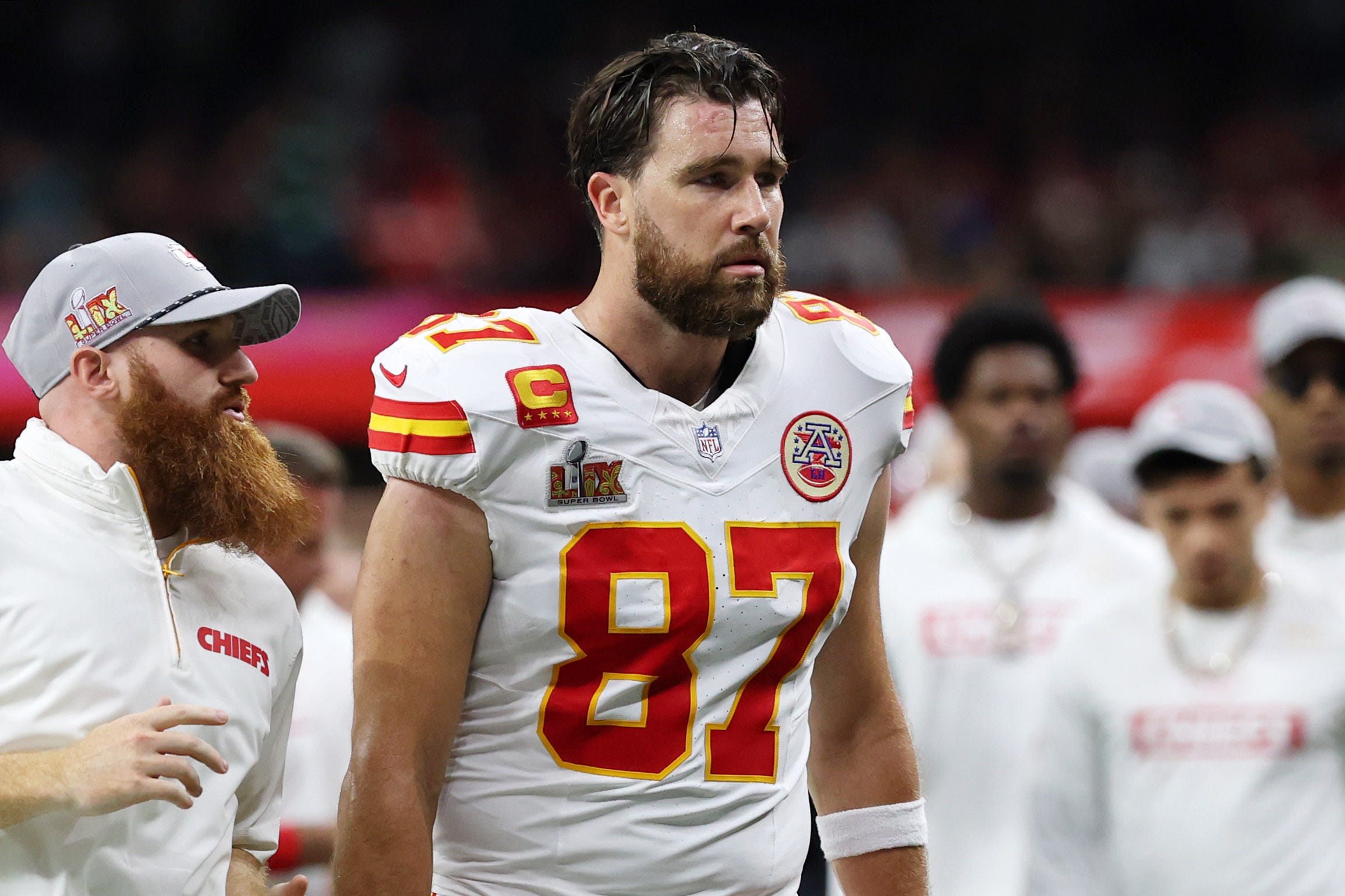 Travis Kelce walks off the field at the end of the first half of Super Bowl 59.