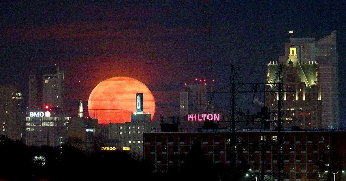 A full moon rises over Milwaukee on Feb. 27, 2021. The full moon is also referred to as the snow moon due to the snow cover on the ground at this time of year.