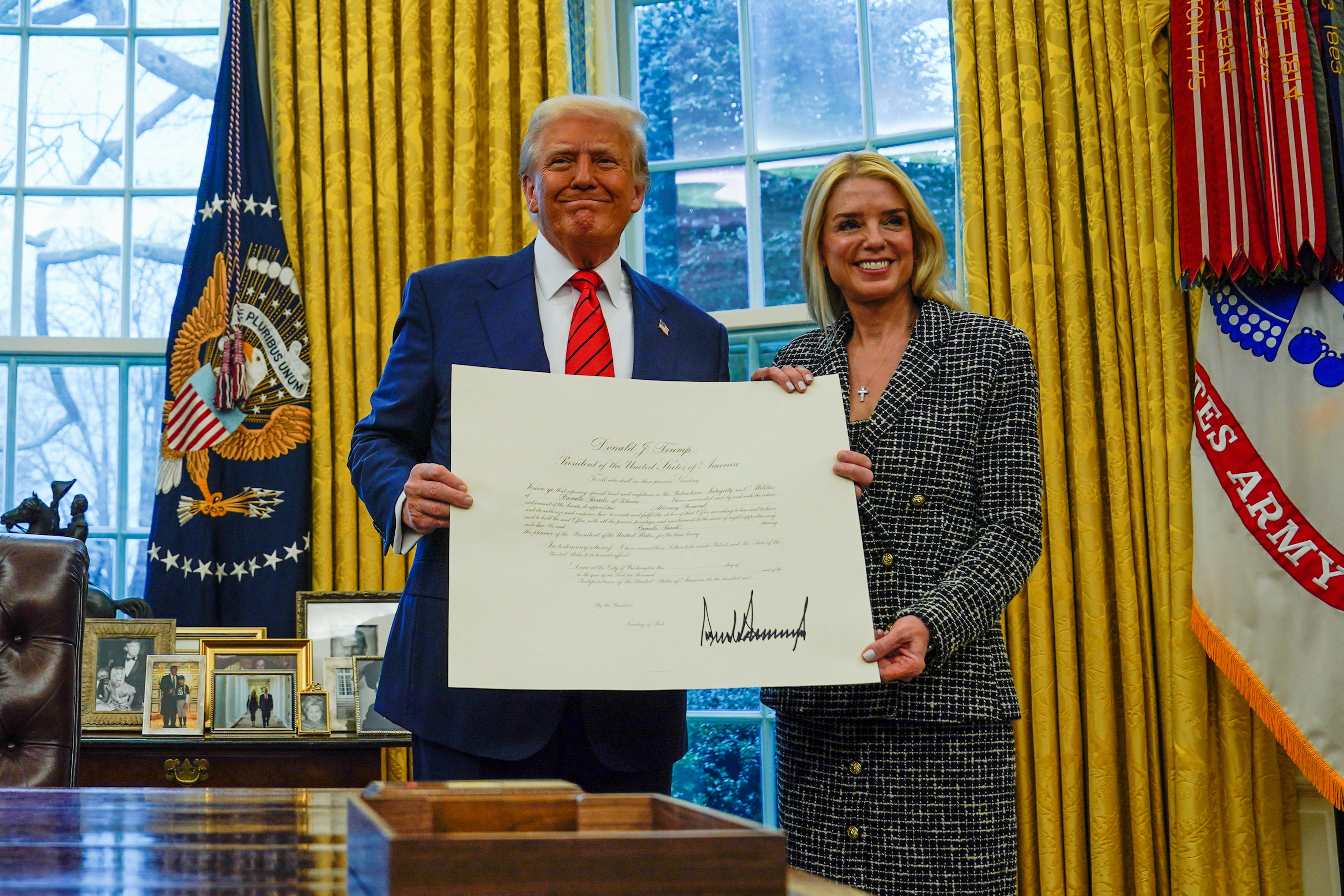U.S. President Donald Trump and U.S. Attorney General Pam Bondi poses on the day of her swearing in ceremony, at the White House in Washington, U.S., February 5, 2025. REUTERS/Kent Nishimura