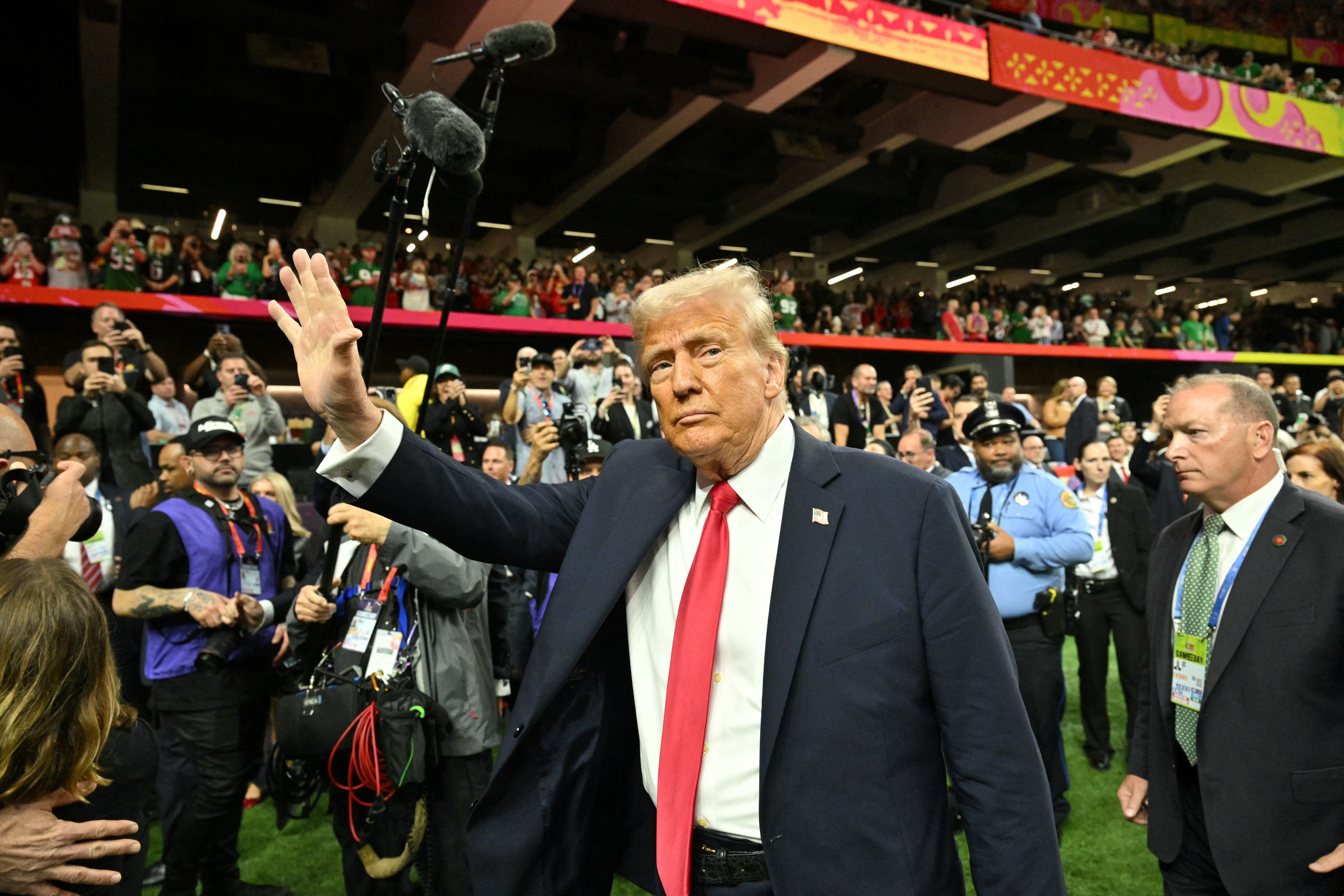 TOPSHOT - US President Donald Trump visits the field before the start of Super Bowl LIX between the Kansas City Chiefs and the Philadelphia Eagles at Caesars Superdome in New Orleans, Louisiana, February 9, 2025. (Photo by ROBERTO SCHMIDT / AFP) (Photo by ROBERTO SCHMIDT/AFP via Getty Images)