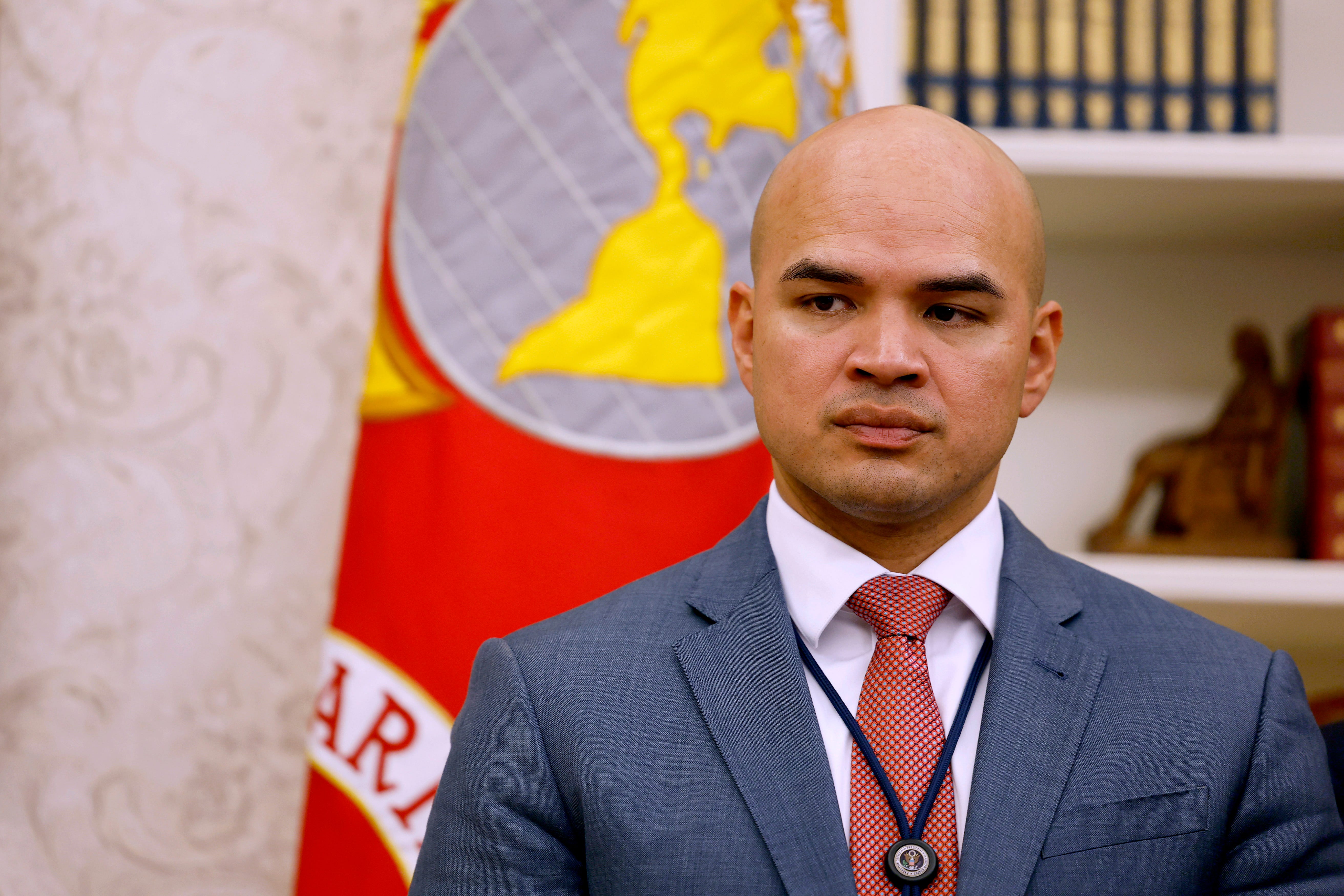 Walt Nauta, an aide to U.S. President Donald Trump, listens as President Trump signs a series of executive orders in the Oval Office of the White House on January 23, 2025 in Washington, DC.