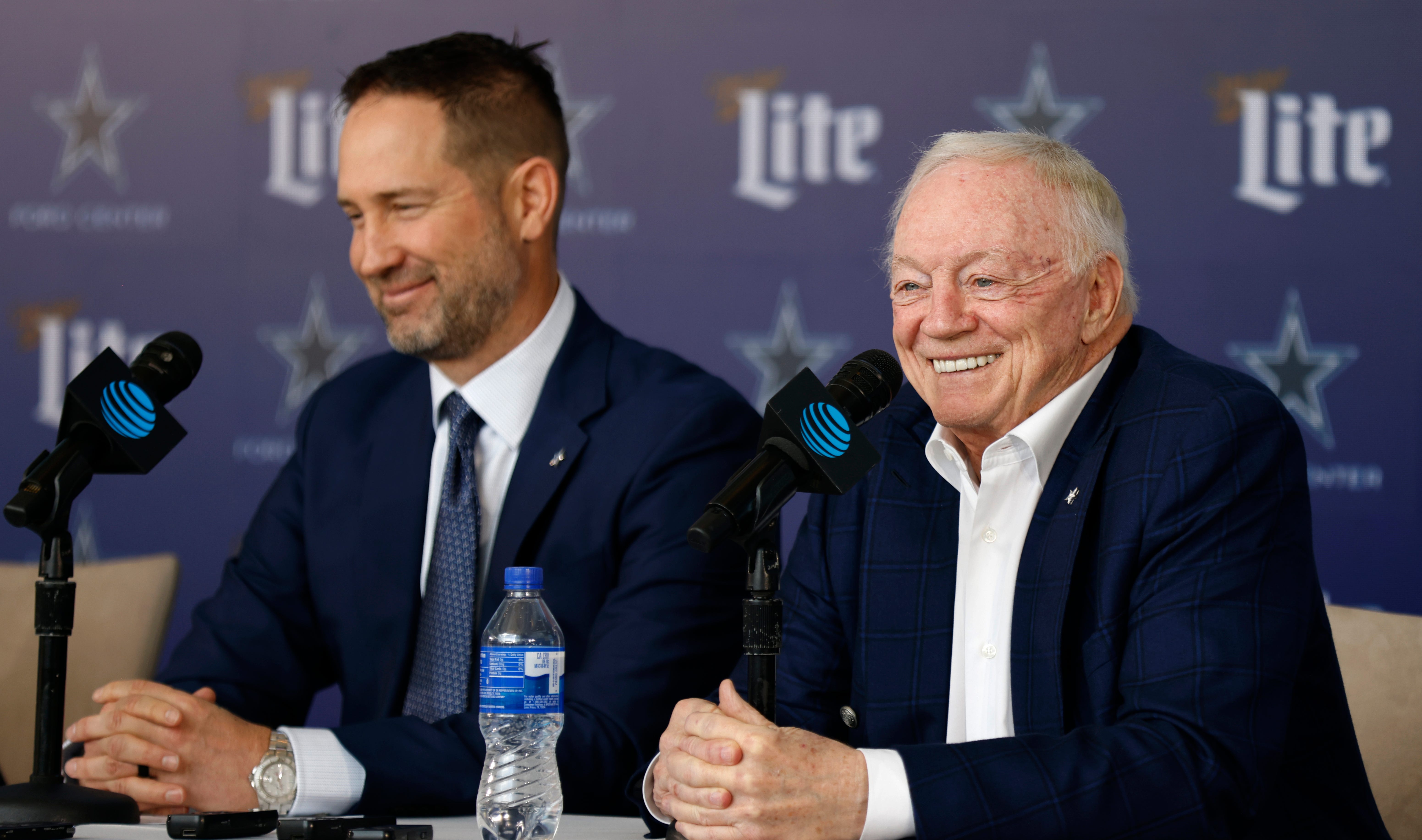 New head coach of the Dallas Cowboys Brian Schottenheimer listens as team owner Jerry Jones talks during a press conference at The Star in Frisco on January 27, 2025 in Frisco, Texas.