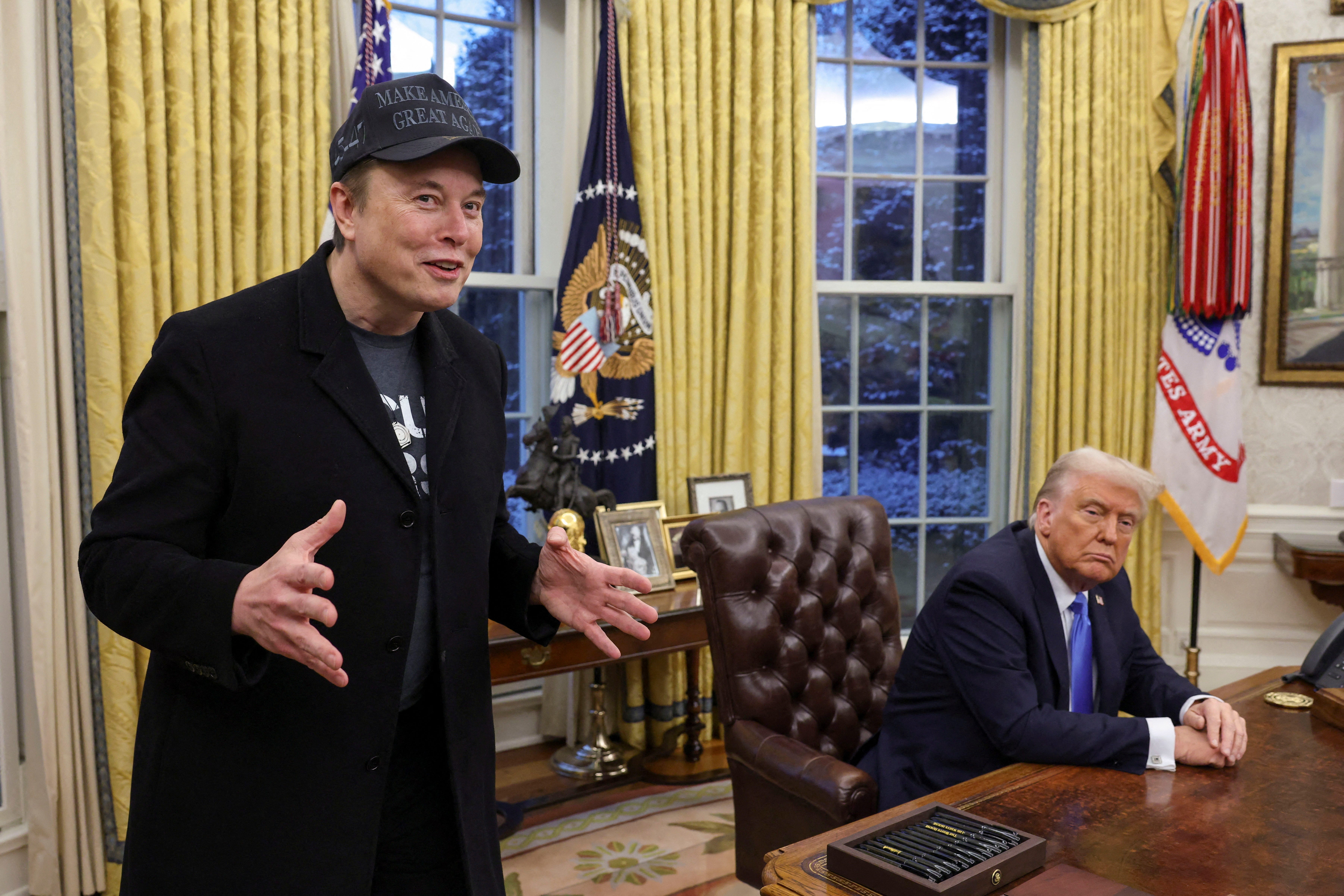 Elon Musk speaks next to President Donald Trump in the Oval Office of the White House in Washington, D.C., on Feb. 11, 2025.