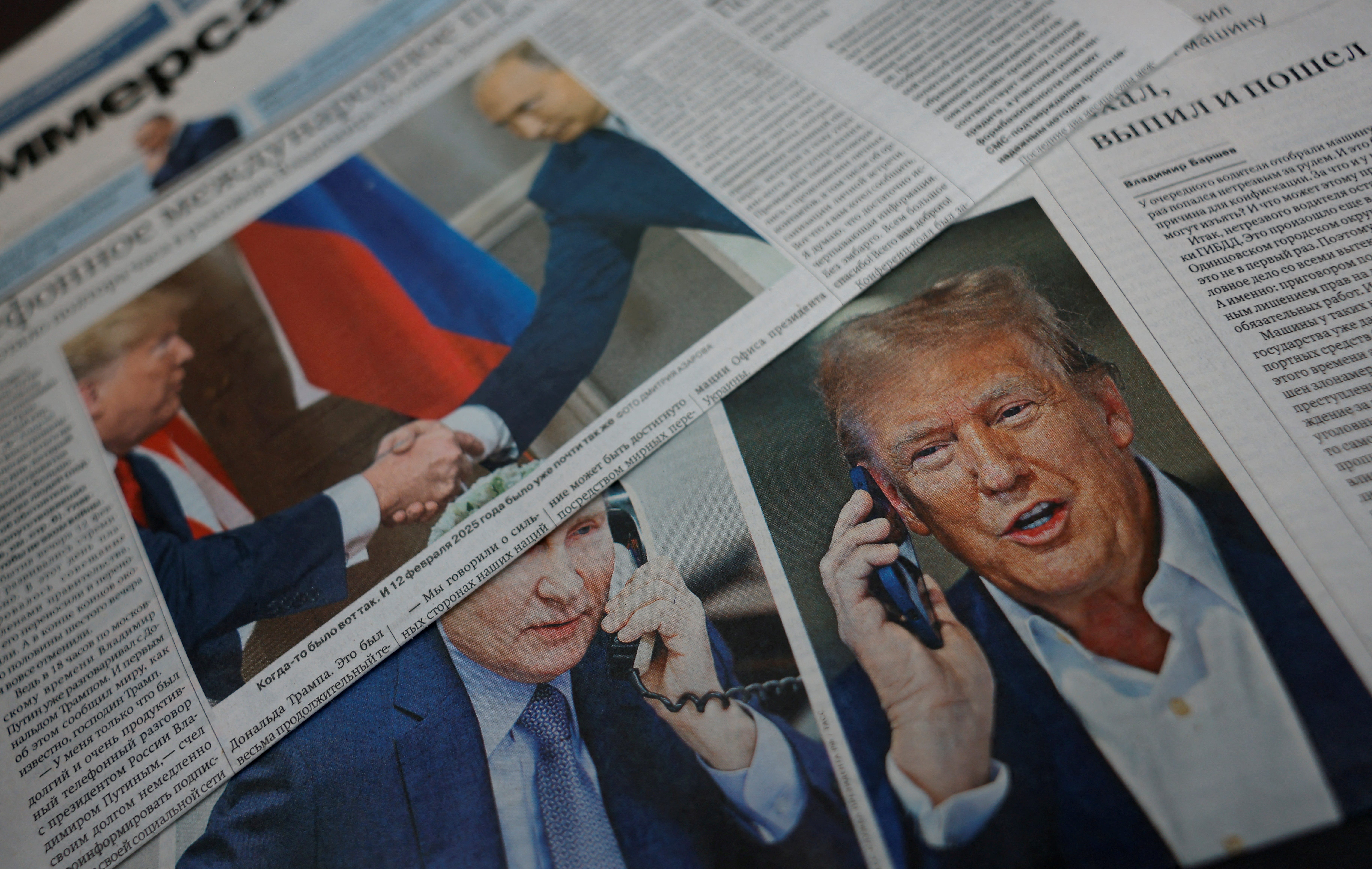 Daily newspapers with covers of Russian President Vladimir Putin and U.S. President Donald Trump in Moscow on Feb. 13, 2025.