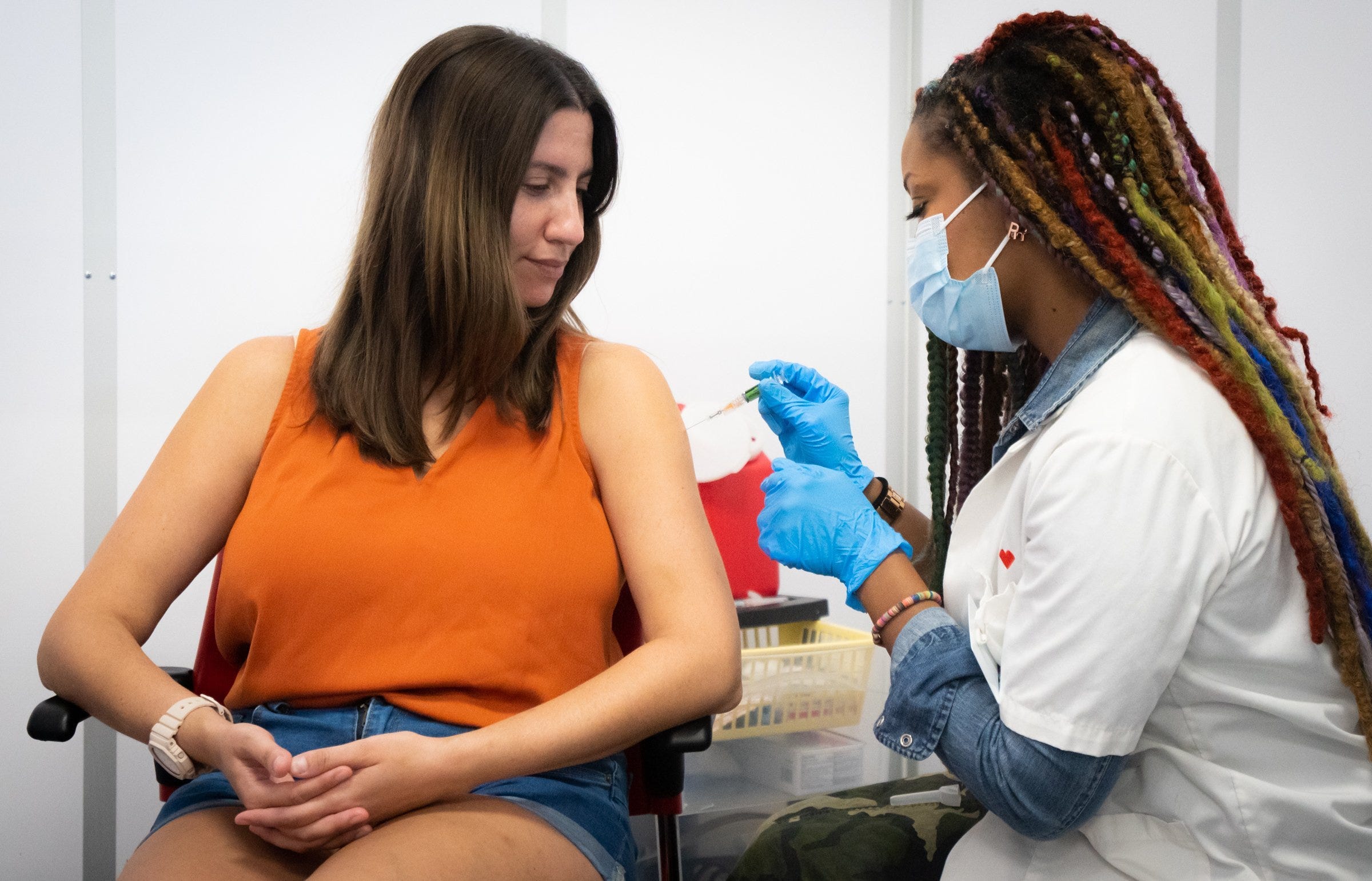 Monica Ortiz receives her flu vaccination from Rochelle Guyse, a pharmacy manager at ta South Austin CVS, in 2023.