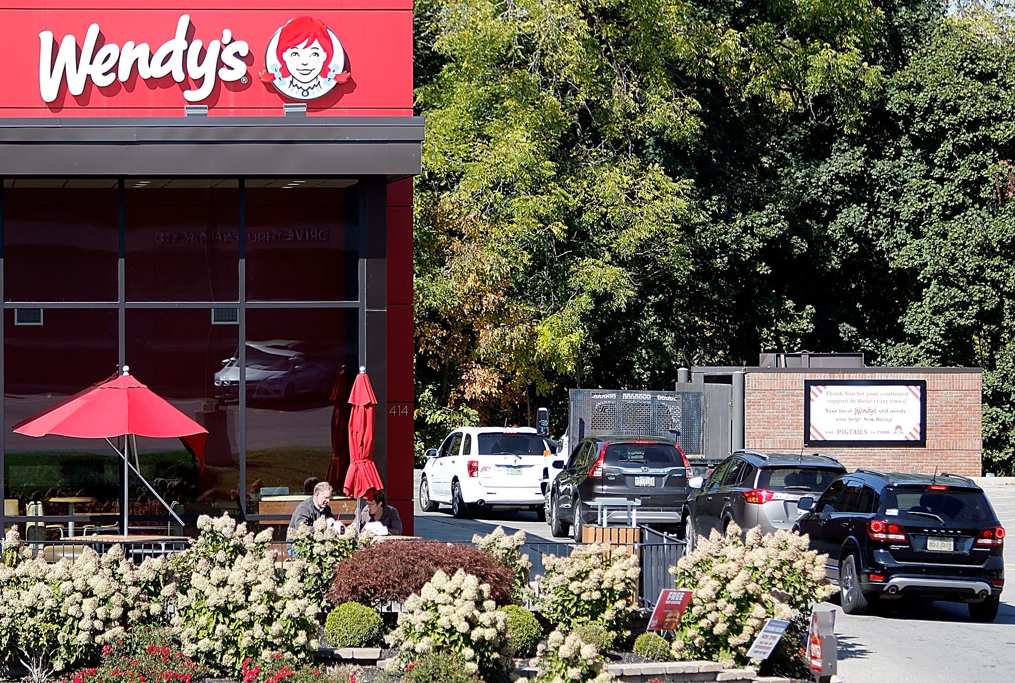 Vehicles are lined up at the drive-thru at a Wendy's restaurant on Oct. 7, 2020.