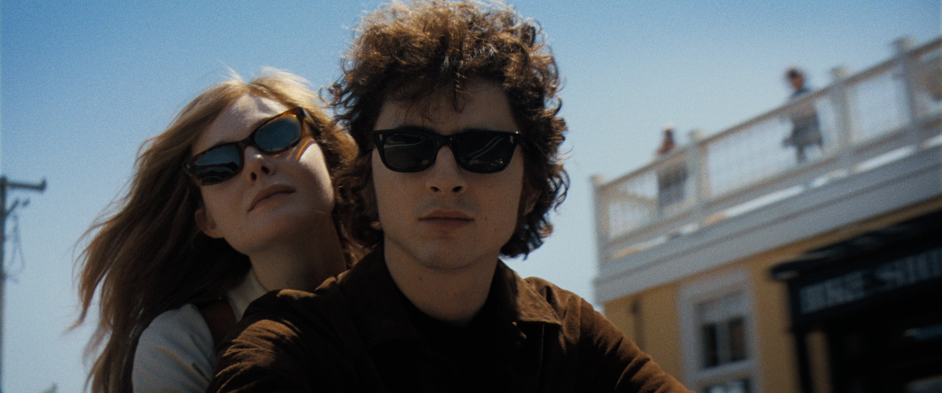Timothée Chalamet (with Elle Fanning) plays folk icon Bob Dylan in the period music biopic "A Complete Unknown."