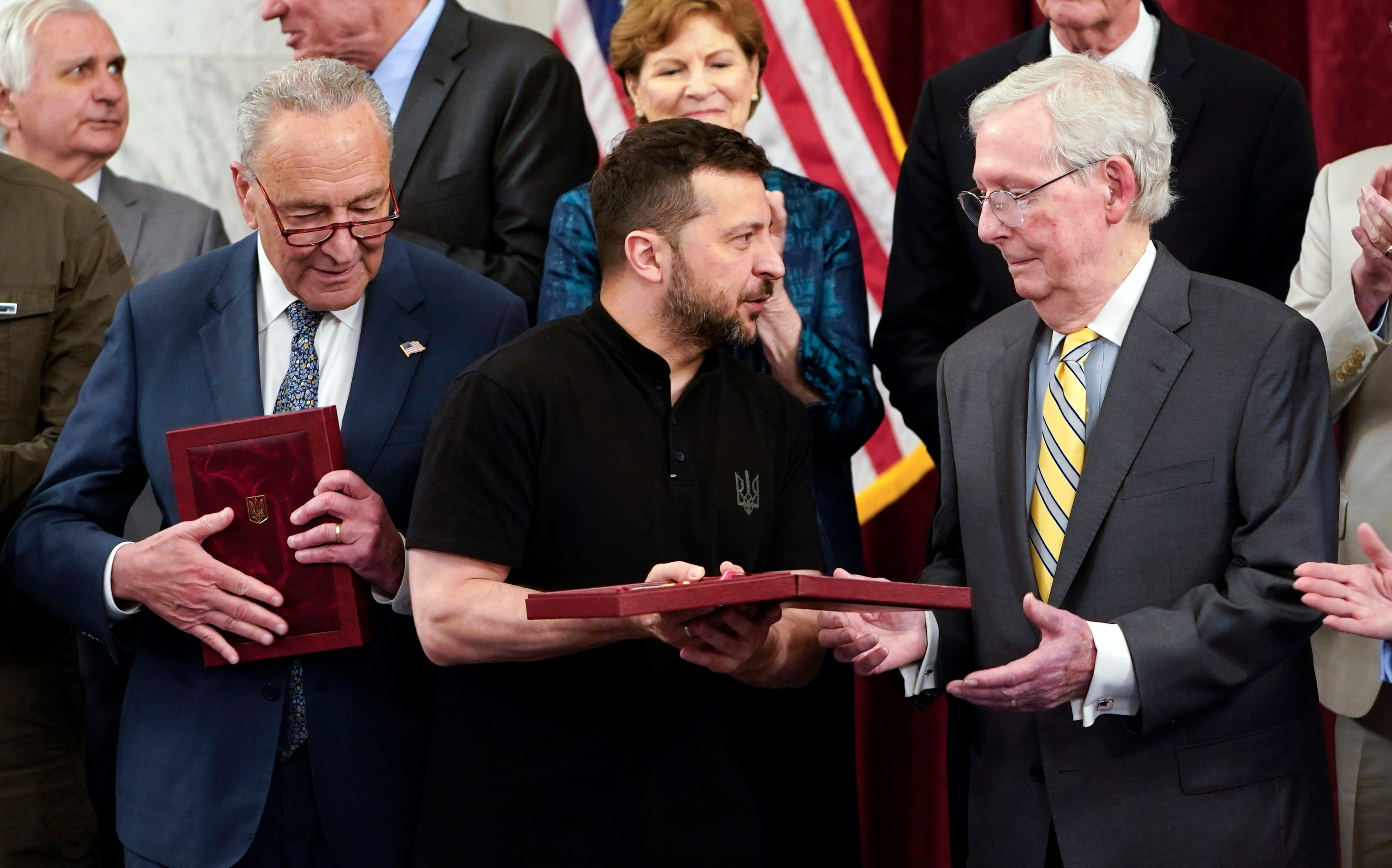 Senate Majority Leader Charles Schumer (D-NY) and Republican Leader Mitch McConnell (R-KY) are presented medals by Ukraine President Volodymyr Zelenskyy, center, on July 10, 2024 in Washington, D.C.