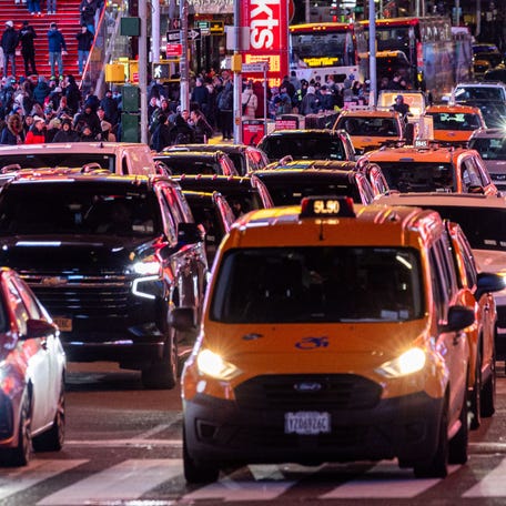 Traffic moves along midtown Manhattan on Feb. 19, 2025 in New York City. Earlier in the day, the Trump administration terminated approval of New York City congestion pricing.