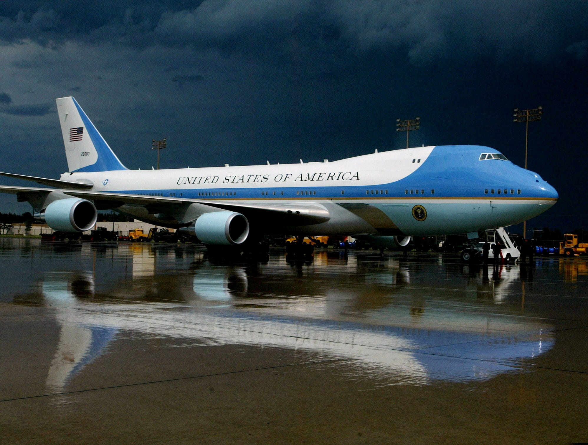 FILE PHOTO: Air Force One is reflected in the rain-soaked tarmac at Sawyer International Airport in Michigan./File Photo