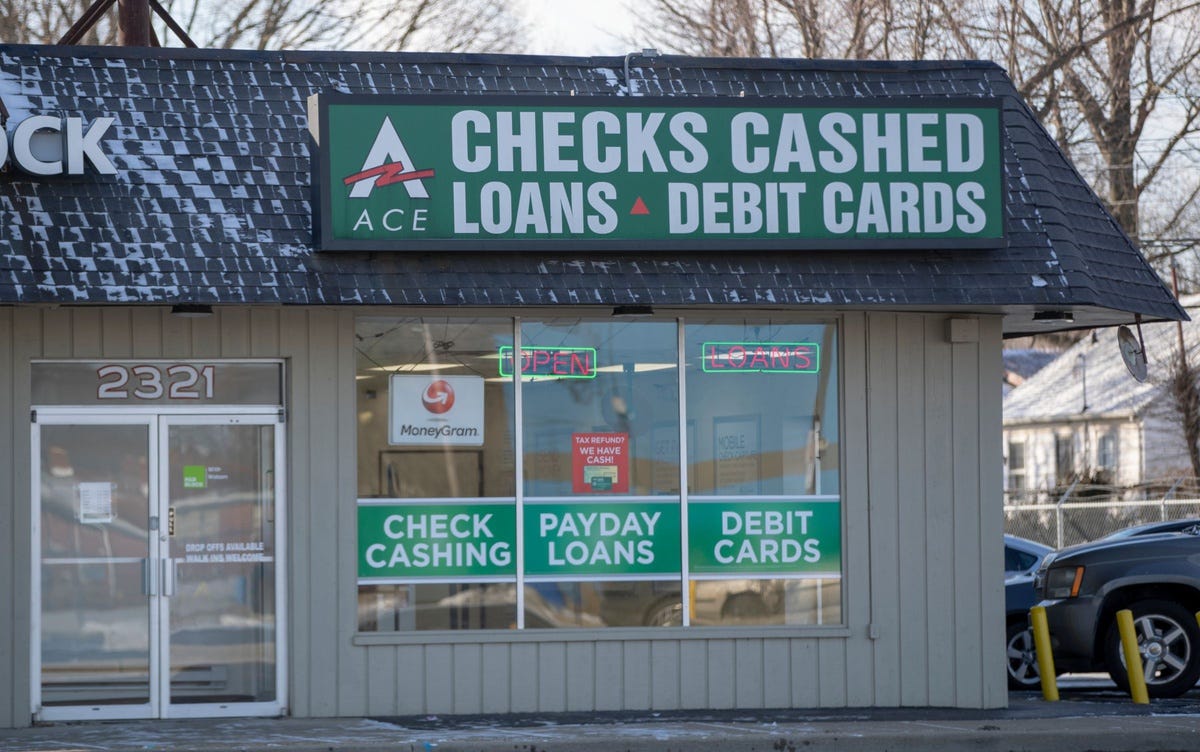 A payday loan business at the corner of W. 38th Street and North Keystone Ave, Indianapolis, Tuesday, Indiana lawmakers are debating a proposal to cap the Annual Percentage Rate charged on short-term, payday loans at 36 percent. State law currently allows payday lenders to charge the equivalent of 391 APR on two-week loans of up to $605.    Payday Lenders Could See Cap In Interest They Make
