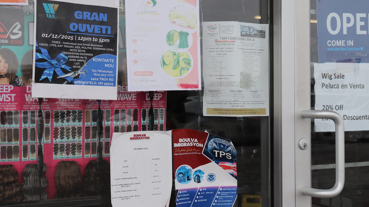 Flyers with information about temporary protected status written in Haitian Creole hung outside Beauty Depot in Springfield. The Trump administration ended TPS for Haitians ending it in August. Photo taken 2/21/2025.