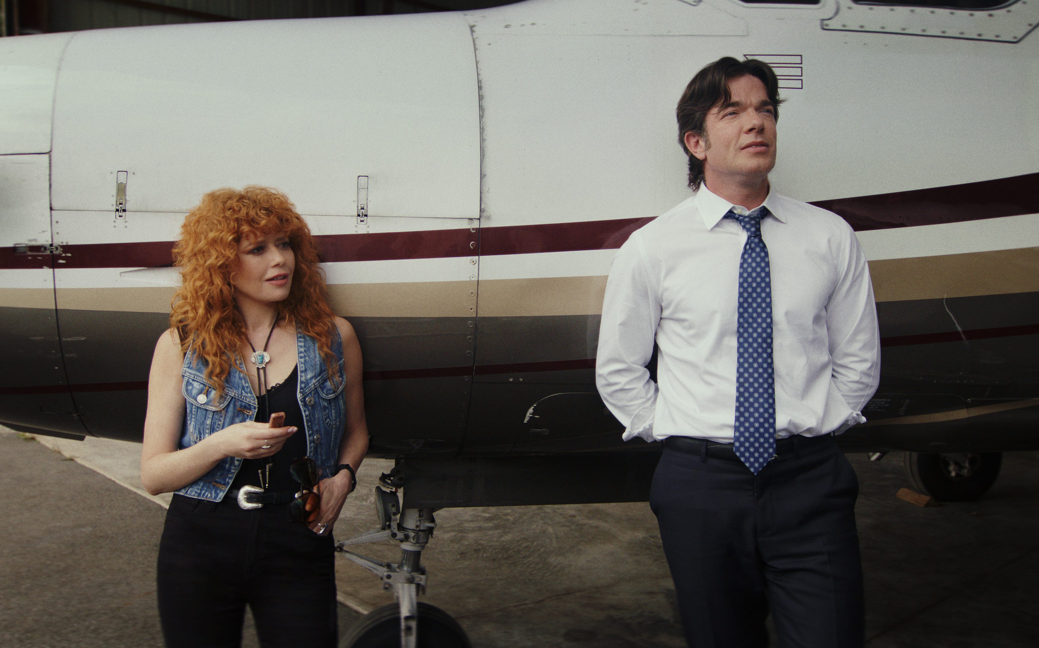John Mulaney, right, is one of a multitude of stars joining Natasha Lyonne in Peacock's "Poker Face" Season 2. Get a first look at more of the familiar faces stopping by the murder-of-the-week comedy this spring.