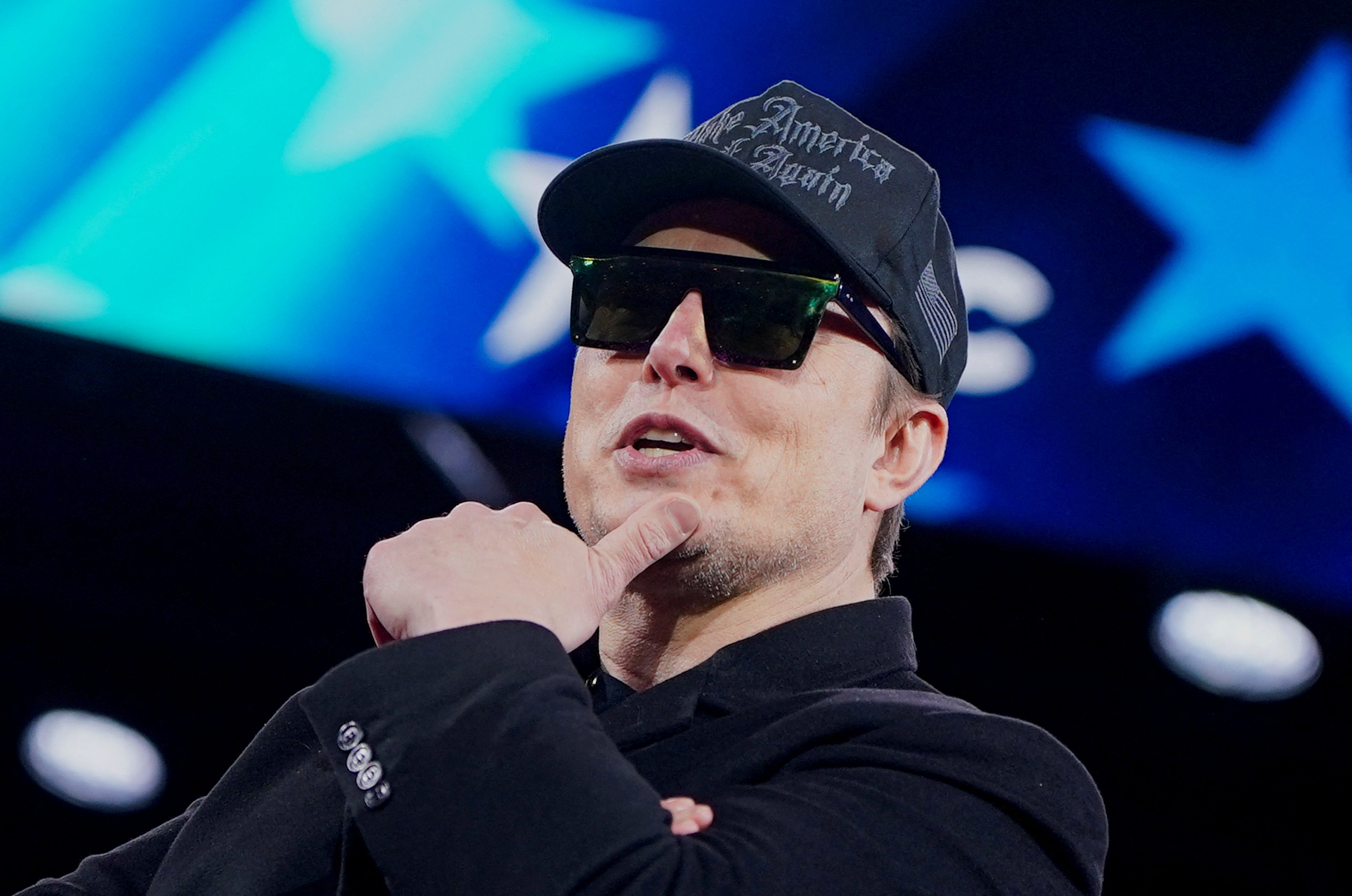 Elon Musk gestures onstage as he attends the Conservative Political Action Conference (CPAC) in National Harbor, Maryland, U.S., February 20, 2025. REUTERS/Nathan Howard