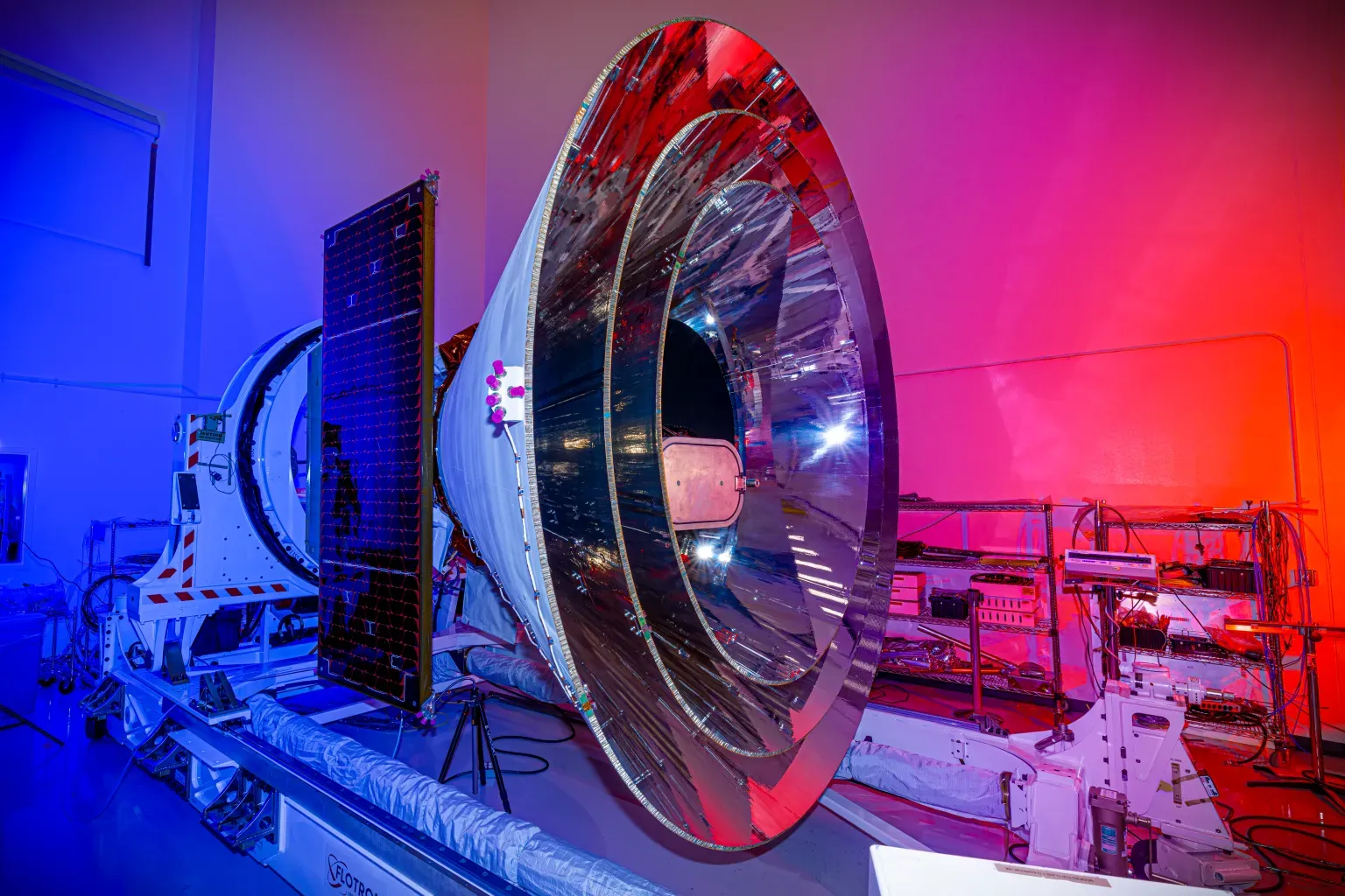 NASA's SPHEREx space observatory was photographed at BAE Systems in Boulder, Colorado, in November 2024 after completing environmental testing. The spacecraft's three concentric cones help direct heat and light away from the telescope and other components, keeping them cool.
