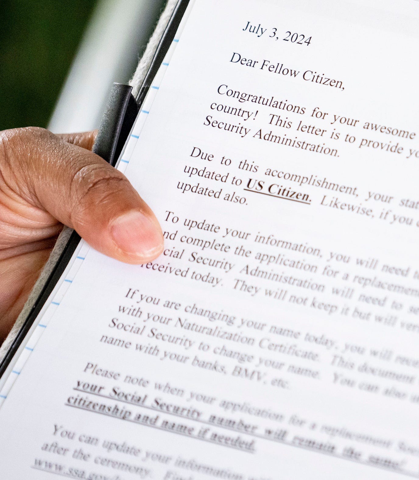 Social Security Administration public affairs specialist Charo Boyd reads through her remarks Wednesday, July 3, 2024, before the naturalization ceremony at the Benjamin Harrison Presidential Site in Indianapolis.