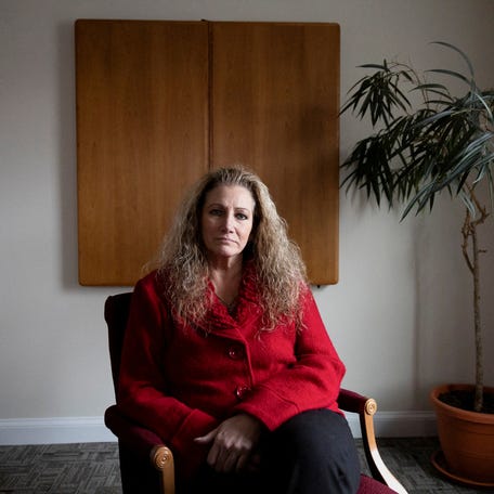 Marlean Ames sits for a portrait at the law office of Edward Gilbert, her lawyer, in Akron, Ohio, on Feb. 13, 2025.