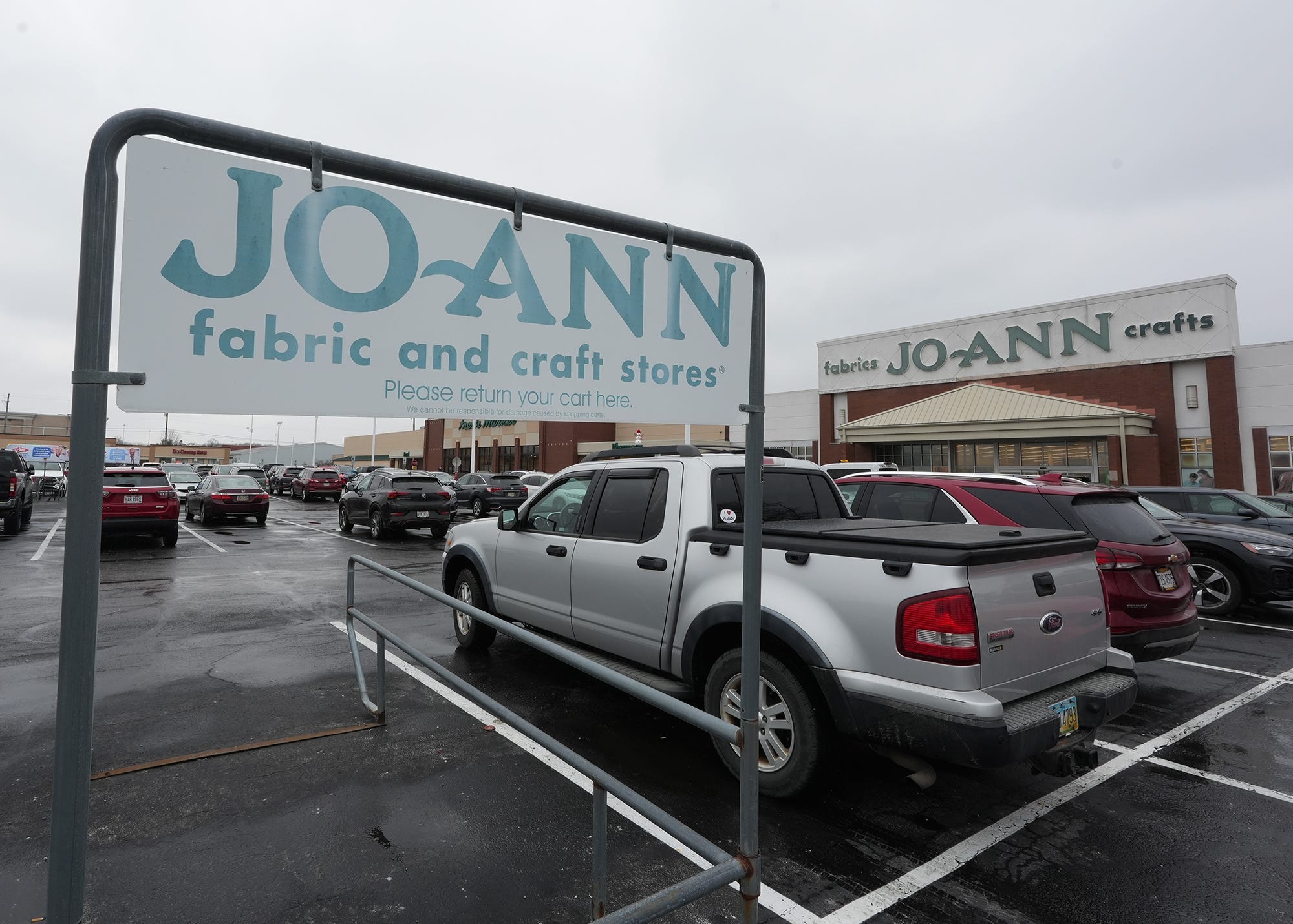 A Joann cart corral is pictured in the parking lot near the Joann fabric and craft store on Medina Road on Thursday, Feb. 13, 2025 in Akron.