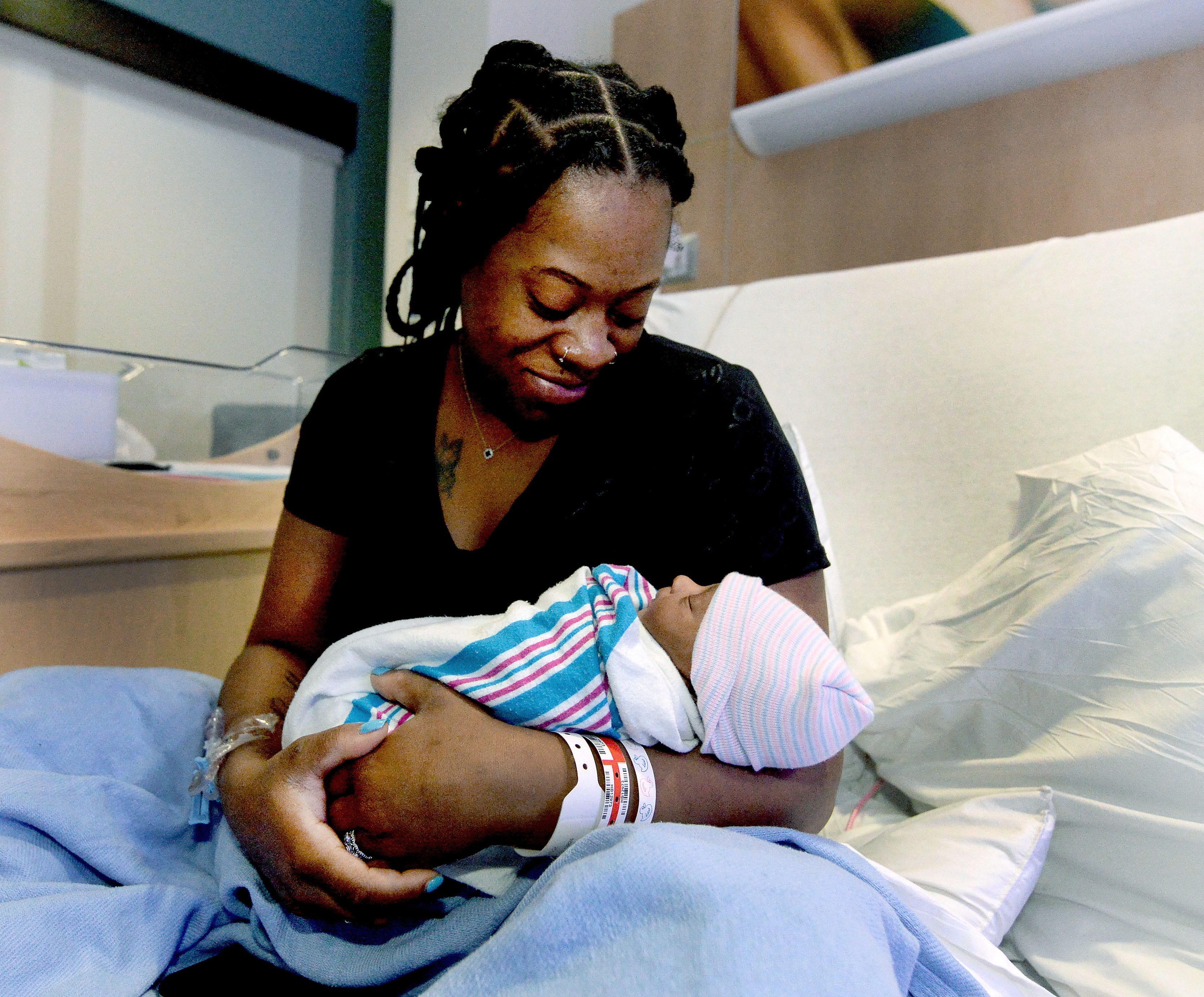 Arion Malone holds her newborn, Aar'ion Henderson, on Thursday, Jan. 2, 2025, at HSHS St. John's Hospital. Henderson is the first baby born in Springfield for 2025.