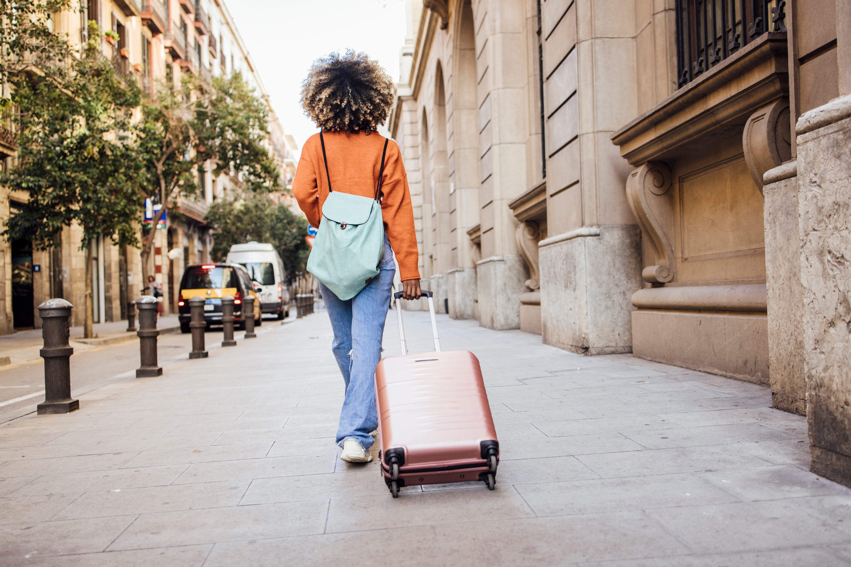 A young woman on vacation arriving in Barcelona.