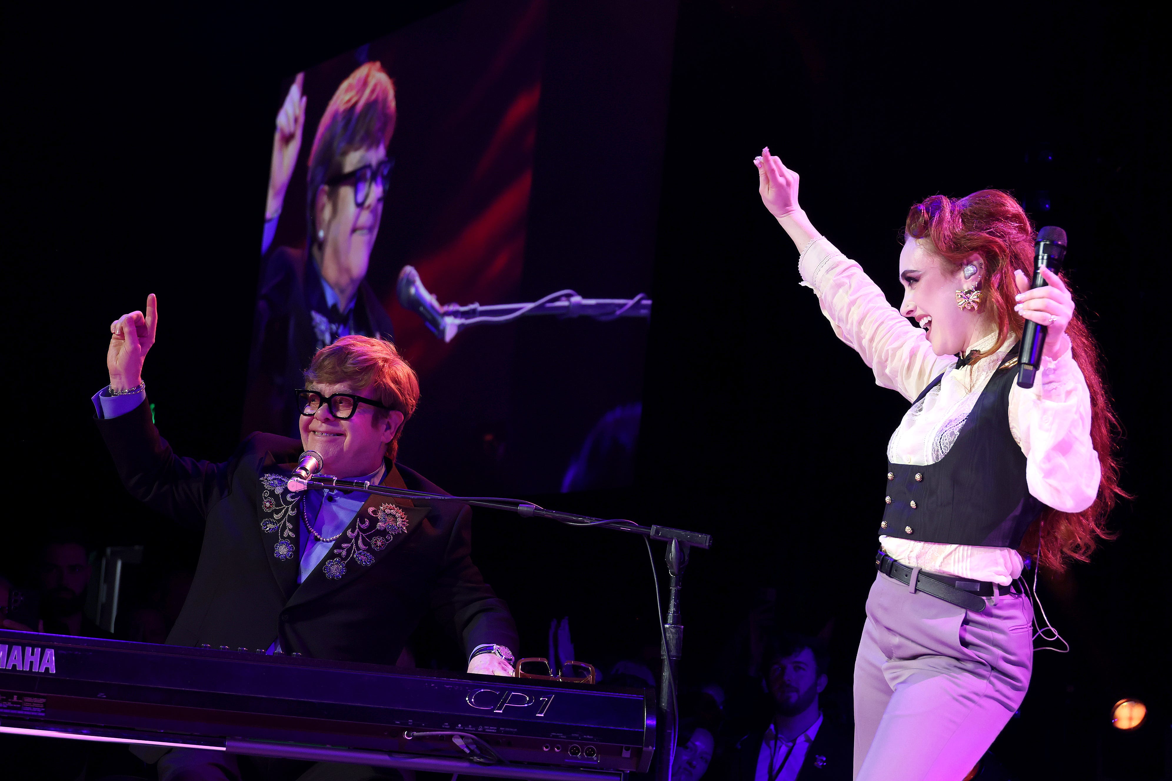 WEST HOLLYWOOD, CALIFORNIA - MARCH 02: (Exclusive Coverage) (L-R) Elton John and Chappell Roan perform onstage at Elton John AIDS Foundation's 33rd Annual Academy Awards Viewing Party on March 02, 2025 in West Hollywood, California. (Photo by Michael Loccisano/Getty Images for Elton John AIDS Foundation)