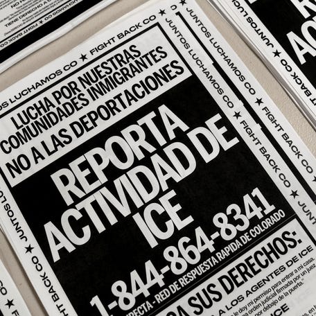 Posters to be distributed to community members ahead of anticipated raids by U.S. Immigrations and Customs (ICE) are stacked on a table in Denver, Colorado, U.S., January 29, 2025. REUTERS/Cheney Orr