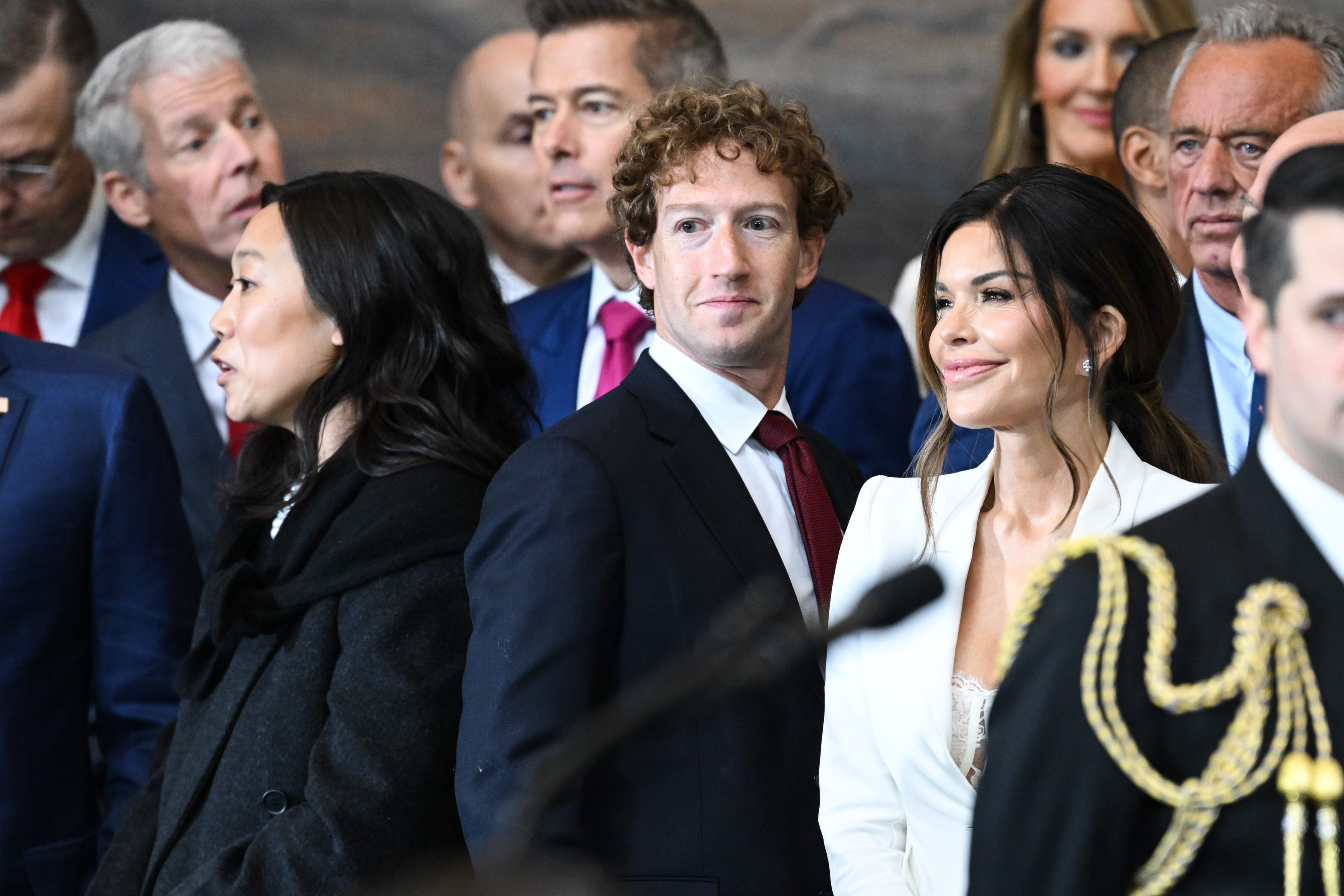 Jan 20, 2025; Washington, DC, USA; (L-R) Priscilla Chan, CEO of Meta and Facebook Mark Zuckerberg, and Lauren Sanchez attend the inauguration ceremony before Donald Trump is sworn in as the 47th US President in the US Capitol Rotunda in Washington, DC, on January 20, 2025. Mandatory Credit: Saul Loeb-Pool via Imagn Images