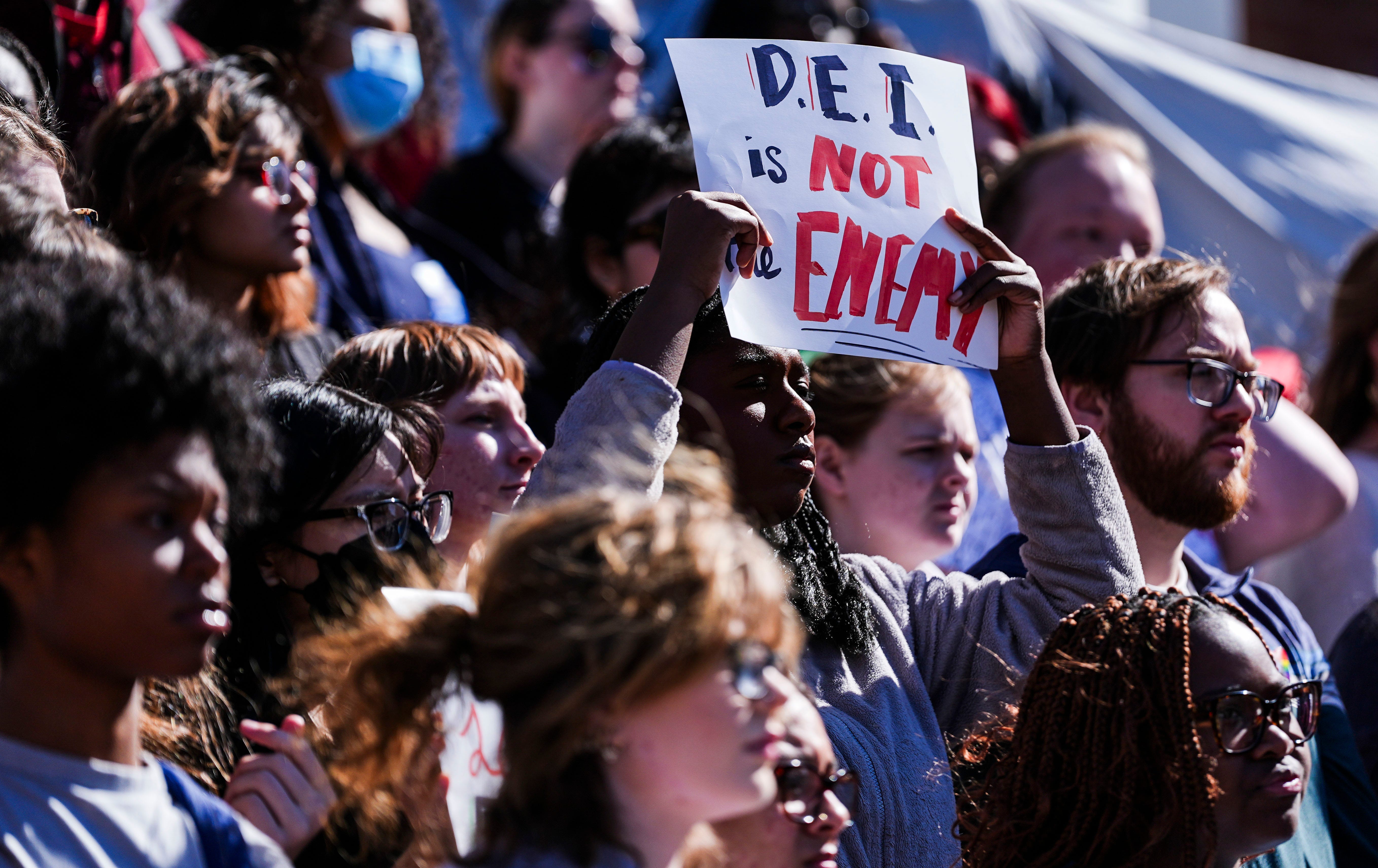 Students chanted and held signs during a rally to protect DEI in America Friday at the University of Louisville campus in Louisville, Kentucky Feb. 28, 2025