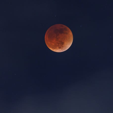 Clouds roll in as a full moon moves through the shadow of the earth during a "Blood Moon" lunar eclipse in San Diego, California, U.S., May 16, 2022.