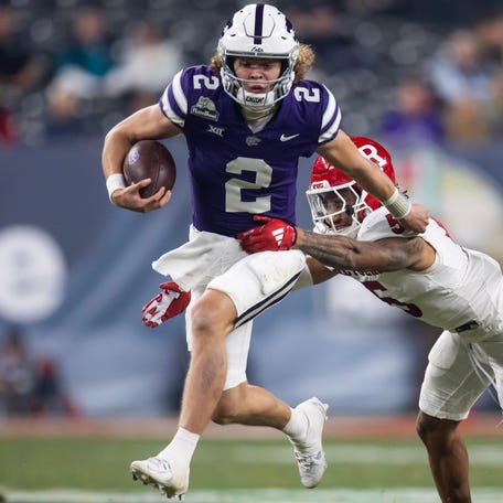 Kansas State quarterback Avery Johnson (2) runs the ball against Rutgers during the 2024 Rate Bowl at Chase Field.