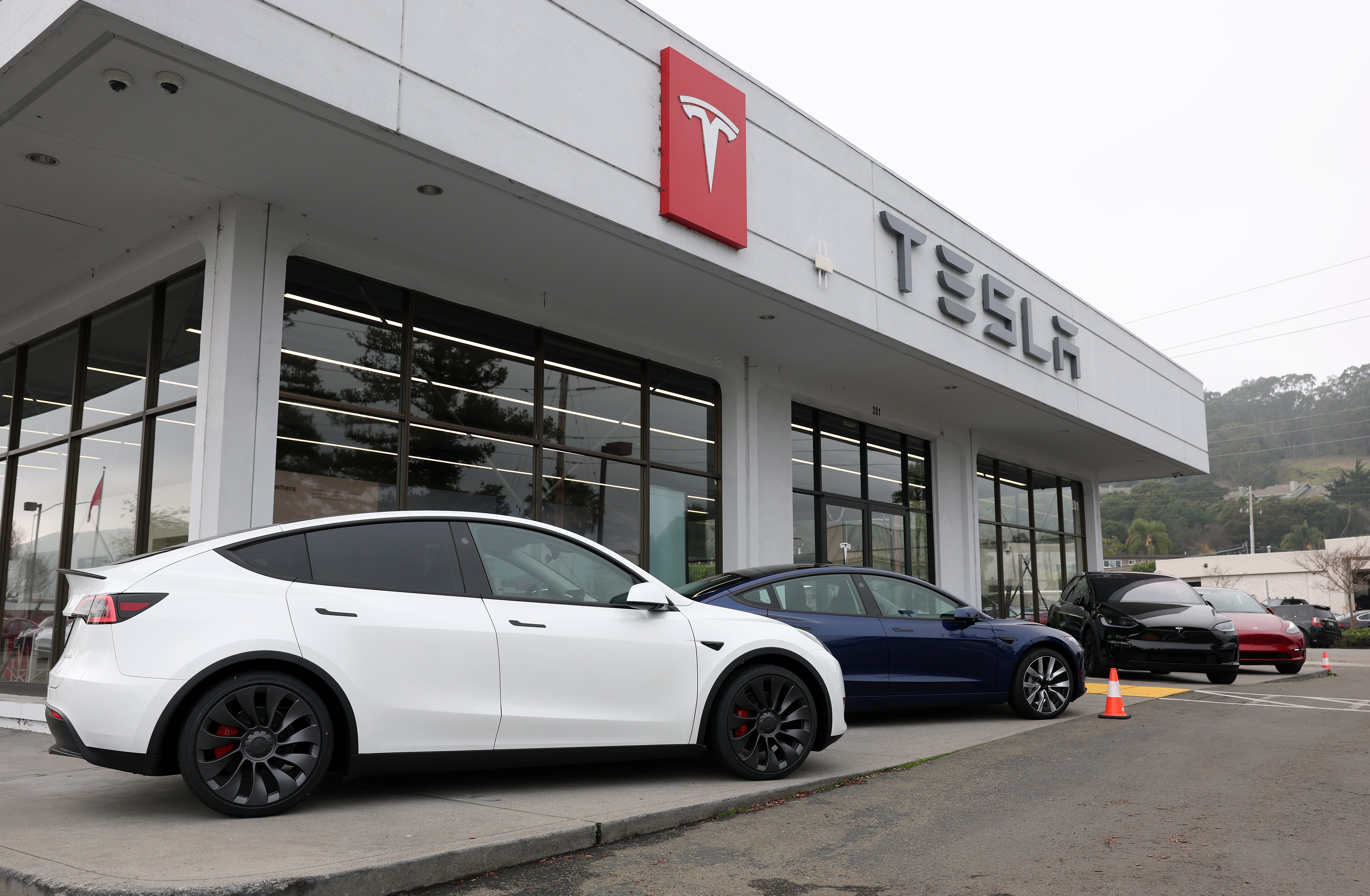 Tesla models Y and 3 are displayed at a Tesla dealership on December 20, 2024 in Corte Madera, California. (Photo by Justin Sullivan/Getty Images)