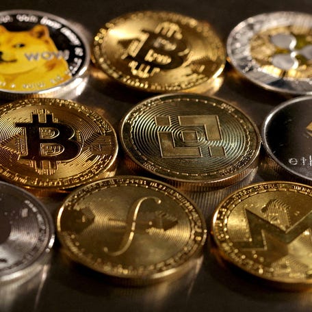 Representations of cryptocurrencies are seen in this illustration, August 10, 2022.
