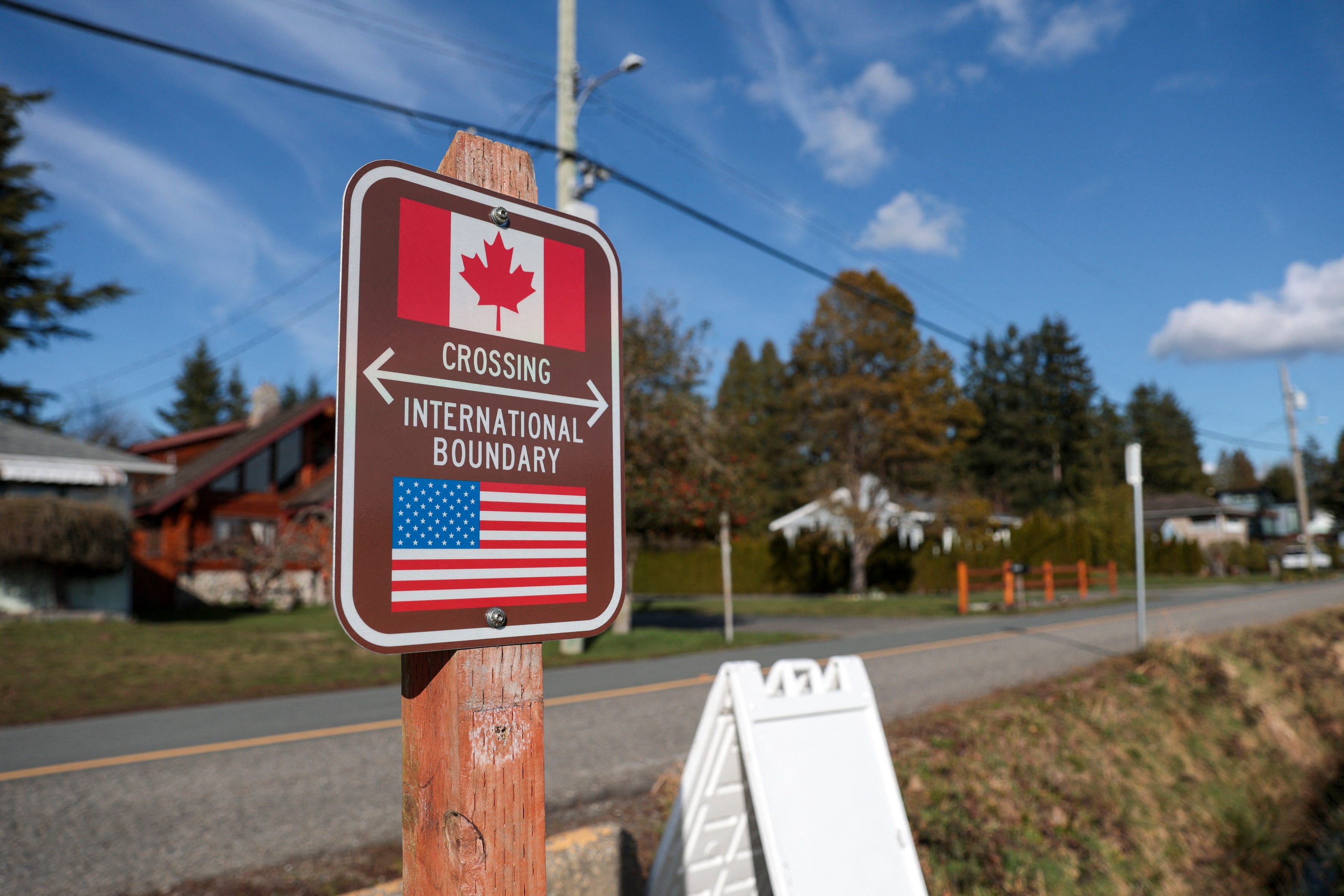 A sign marking the international border between the United States and Canada is pictured at Peace Arch Historical State Park in Blaine, Washington, on March 5, 2025.