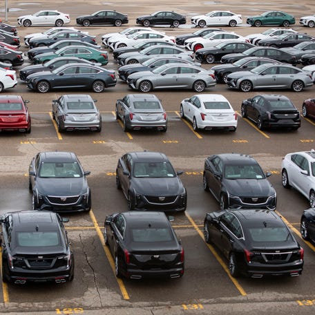 New General Motors vehicles are parked at the GM Lansing Grand River Assembly plant as the first day of President Donald Trump's 25% tariffs on goods from Canada and Mexico goes into effect March 4, 2025 in Lansing, Michigan. President Trump is also adding 10% tariff on imports from China, bringing the tariffs on that country's goods to 20%.