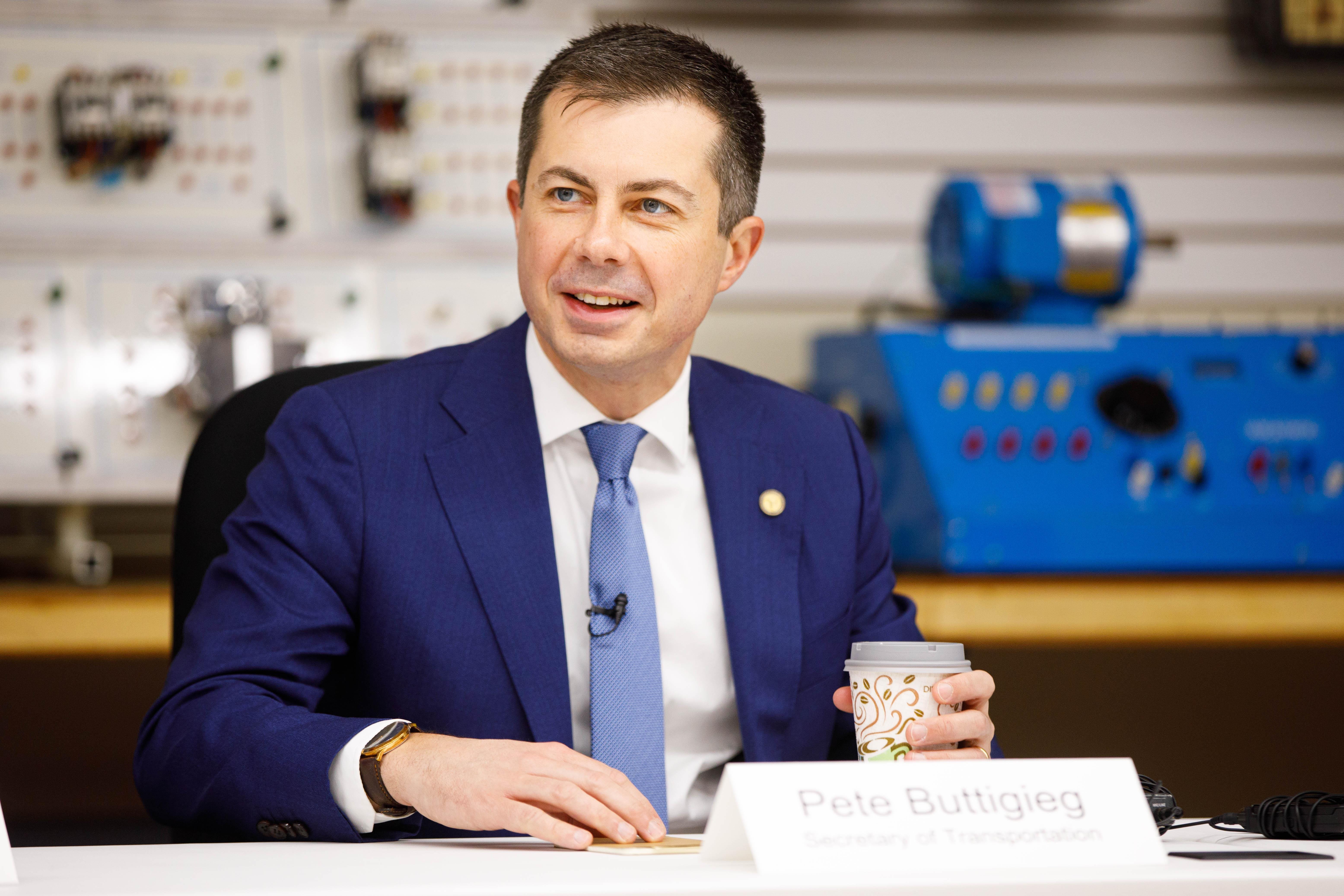U.S. Secretary of Transportation Pete Buttigieg meets with apprentices and union members during a tour of the IBEW Local 153 training facility on Wednesday, Dec. 4, in South Bend.