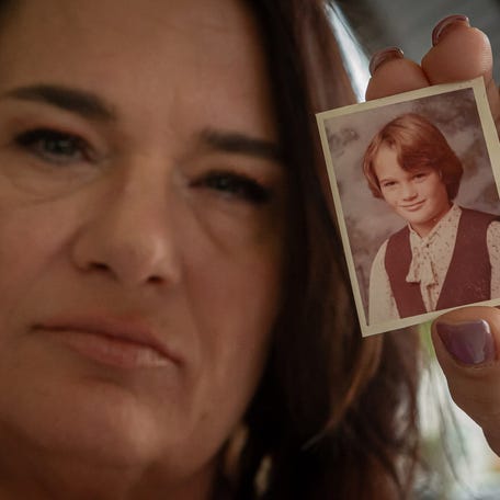 Kris Conyers holds a photo of herself at 11 years old in Boynton Beach, Fla., on November 20, 2024. Conyers was 11 years old in 1983 when she was abducted and sexually assaulted by Christopher Wilder, a wealthy Boynton Beach resident, who a year later would go on a killing rampage across the country, kidnapping 12 women and killing nine of them.
