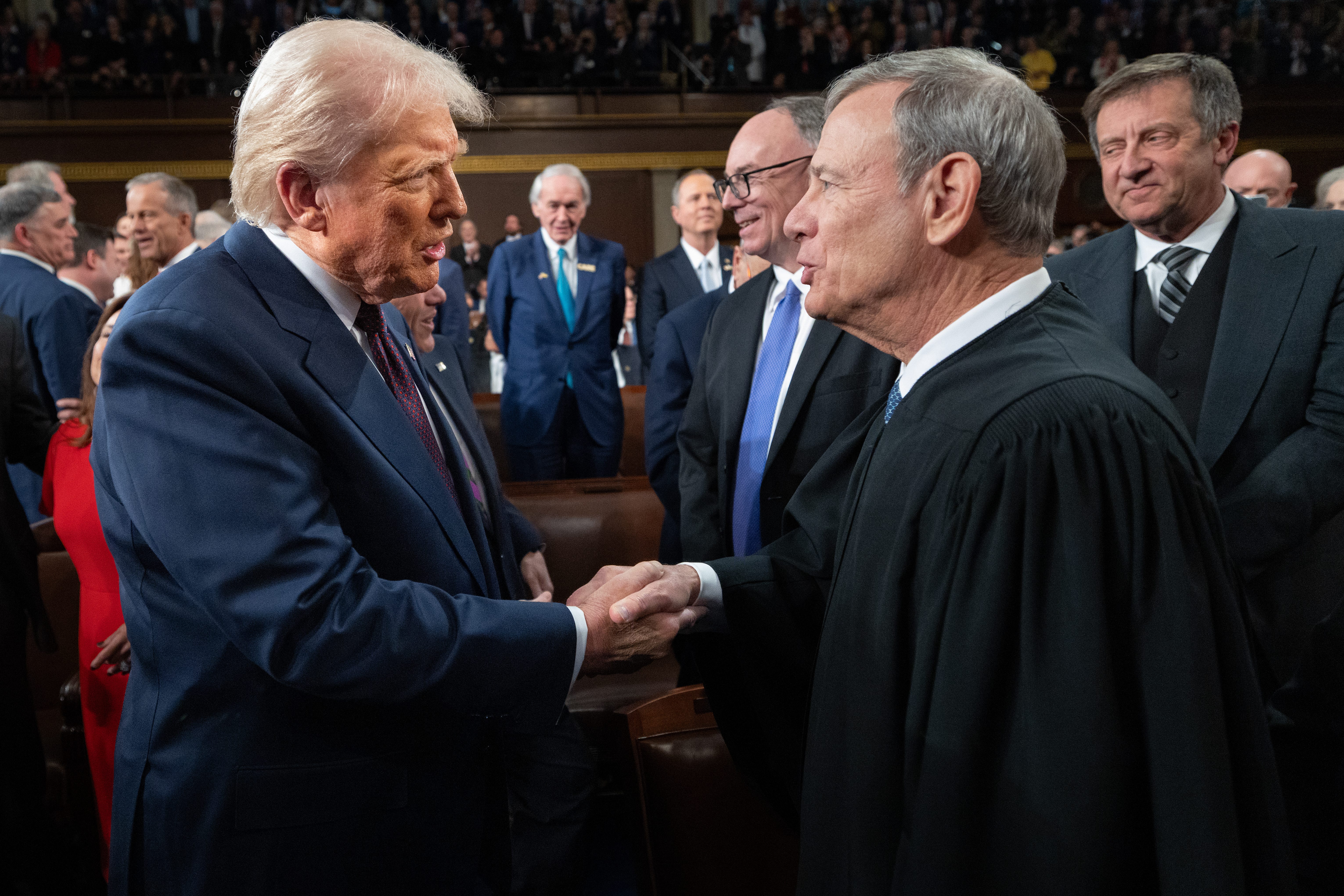 Chief Justice John Roberts greets President Donald Trump as he arrives to deliver an address to a joint session of Congress at the U.S. Capitol on March 4, 2025.