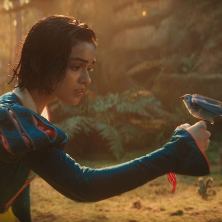 Snow (Rachel Zegler) shares a moment with one of her forest friends in director Marc Webb's live-action musical redo "Snow White."