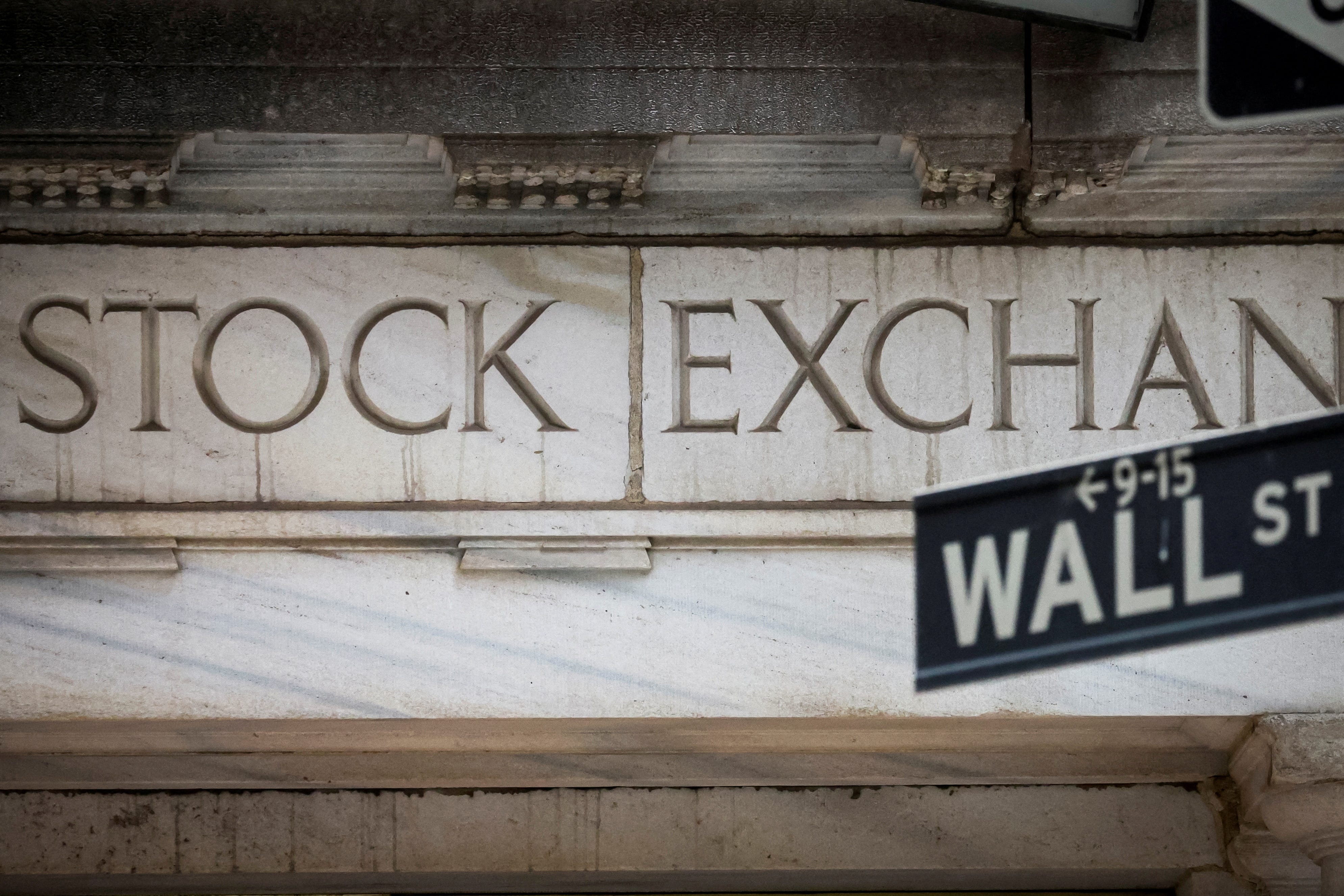 FILE PHOTO: The Wall Street entrance to the New York Stock Exchange (NYSE) is seen in New York City, U.S., November 15, 2022. REUTERS/Brendan McDermid/File Photo