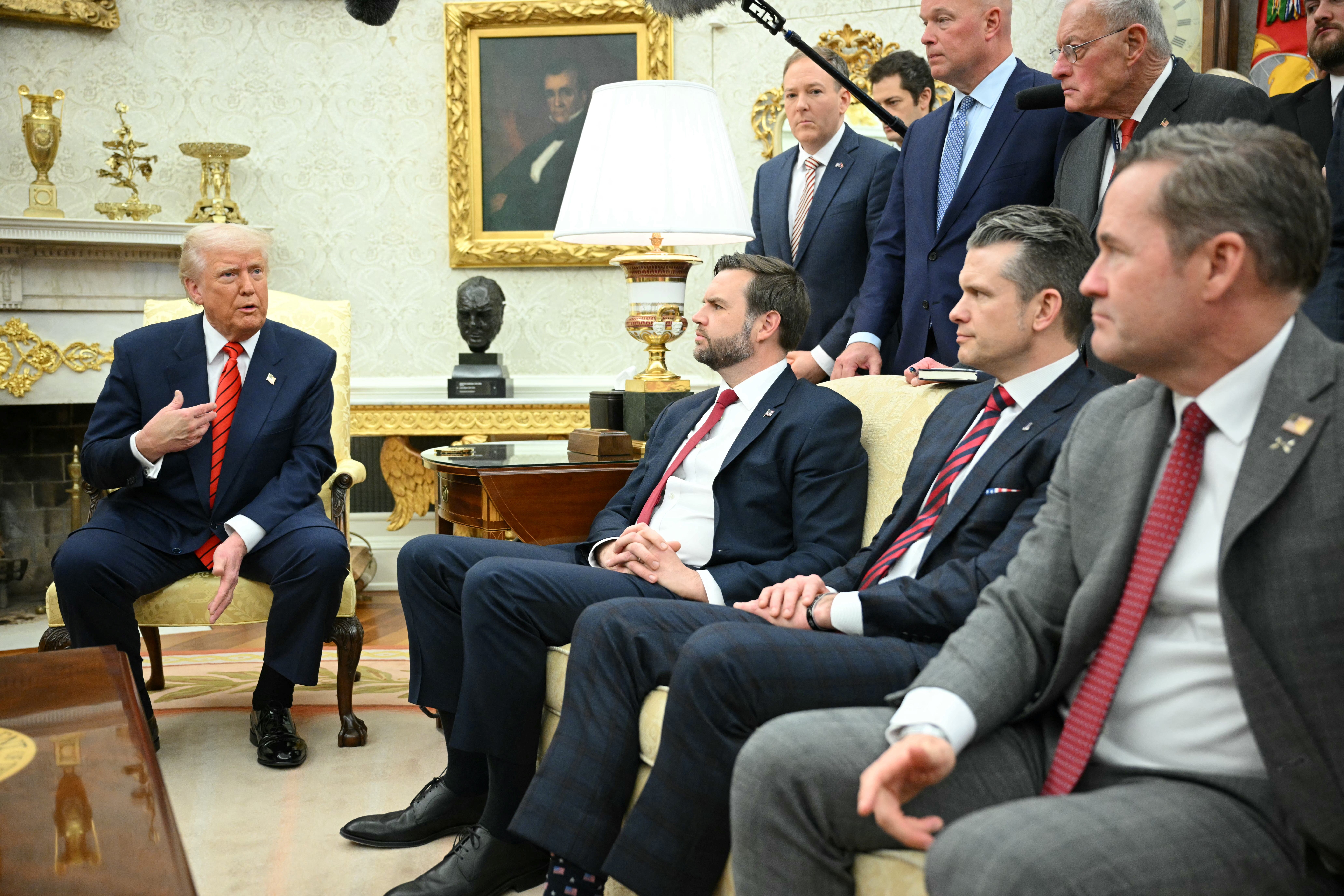 President Donald Trump speaks in a meeting in the Oval Office on March 13, 2025, with, on the couch from left, Vice Presient JD Vance, Defense Secretary Pete Hegseth and national security adviser Mike Waltz.