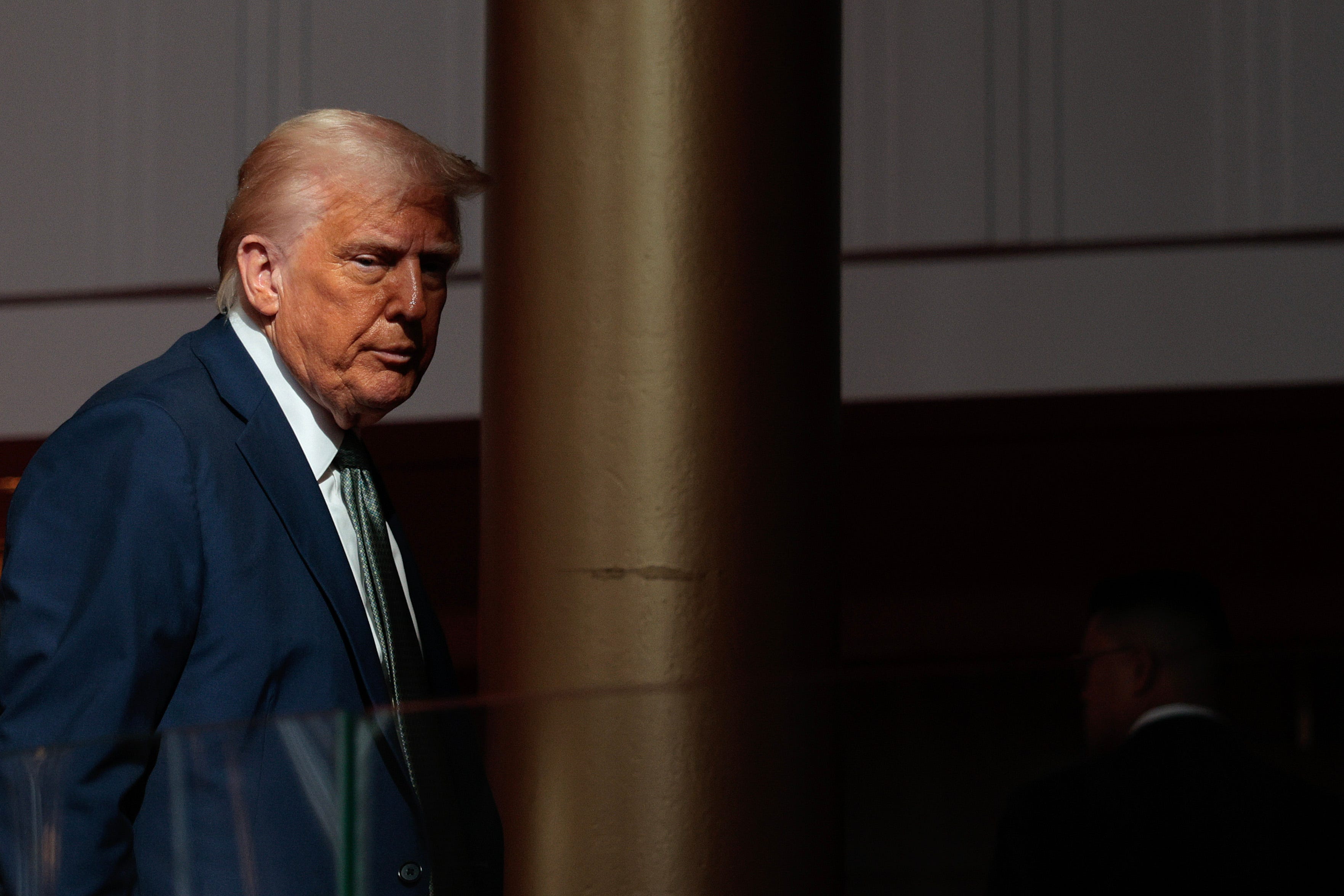 U.S. President Donald Trump departs after speaking with reporters in the Grand Foyer during a tour at the John F. Kennedy Center for the Performing Arts after leading a board meeting on March 17, 2025, in Washington, DC. After shunning the annual Kennedy Center Honors during his first term in the White House, Trump fired the center's president, removed the bipartisan board of Biden appointees, and named himself Chairman of the storied music, theater, and   dance institution.