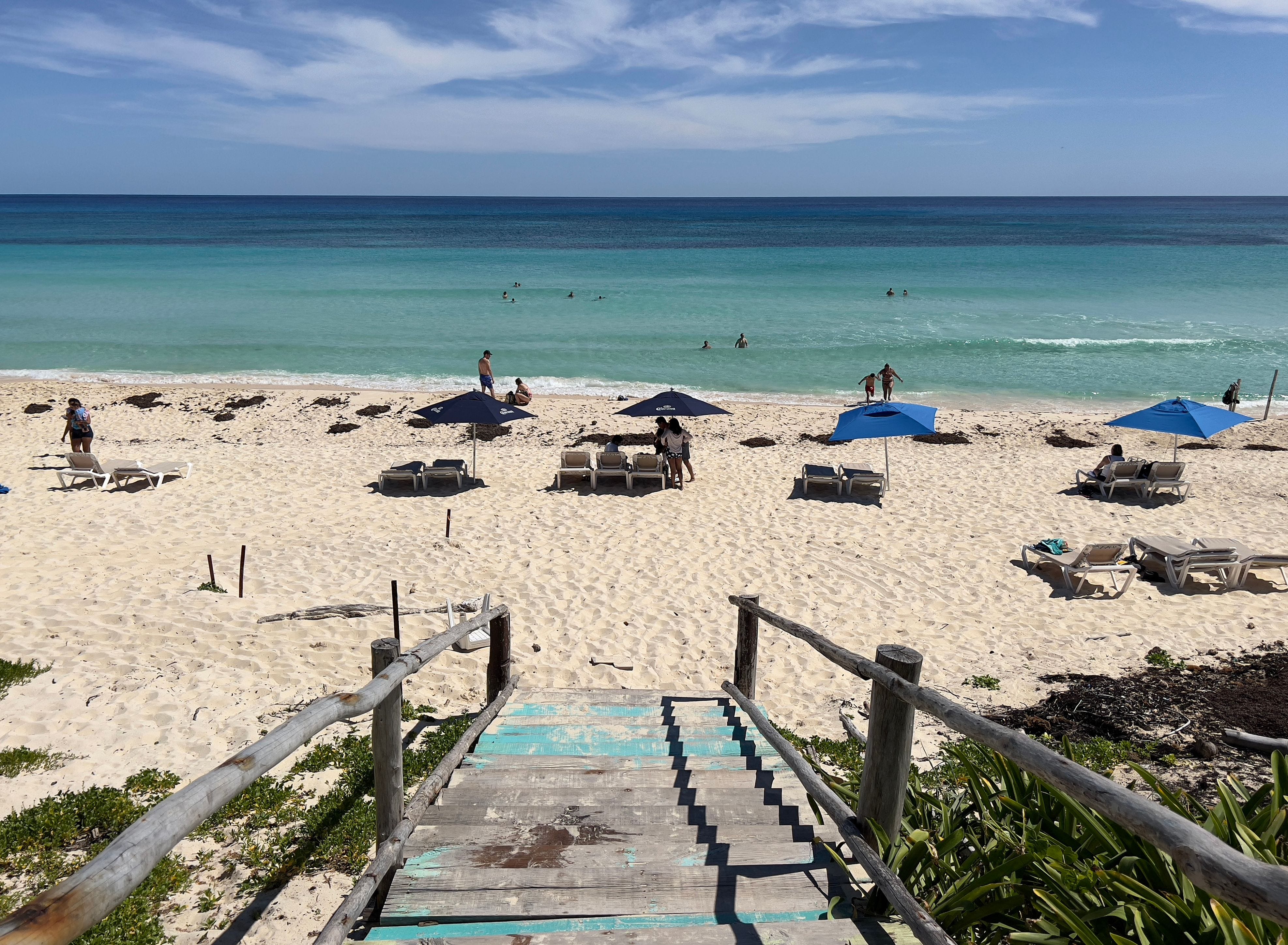 People enjoy a day at the beach in Cozumel island on Mexico's Caribbean coast, just off Playa del Carmen, Quintana Roo, Mexico on Oct. 31, 2021.