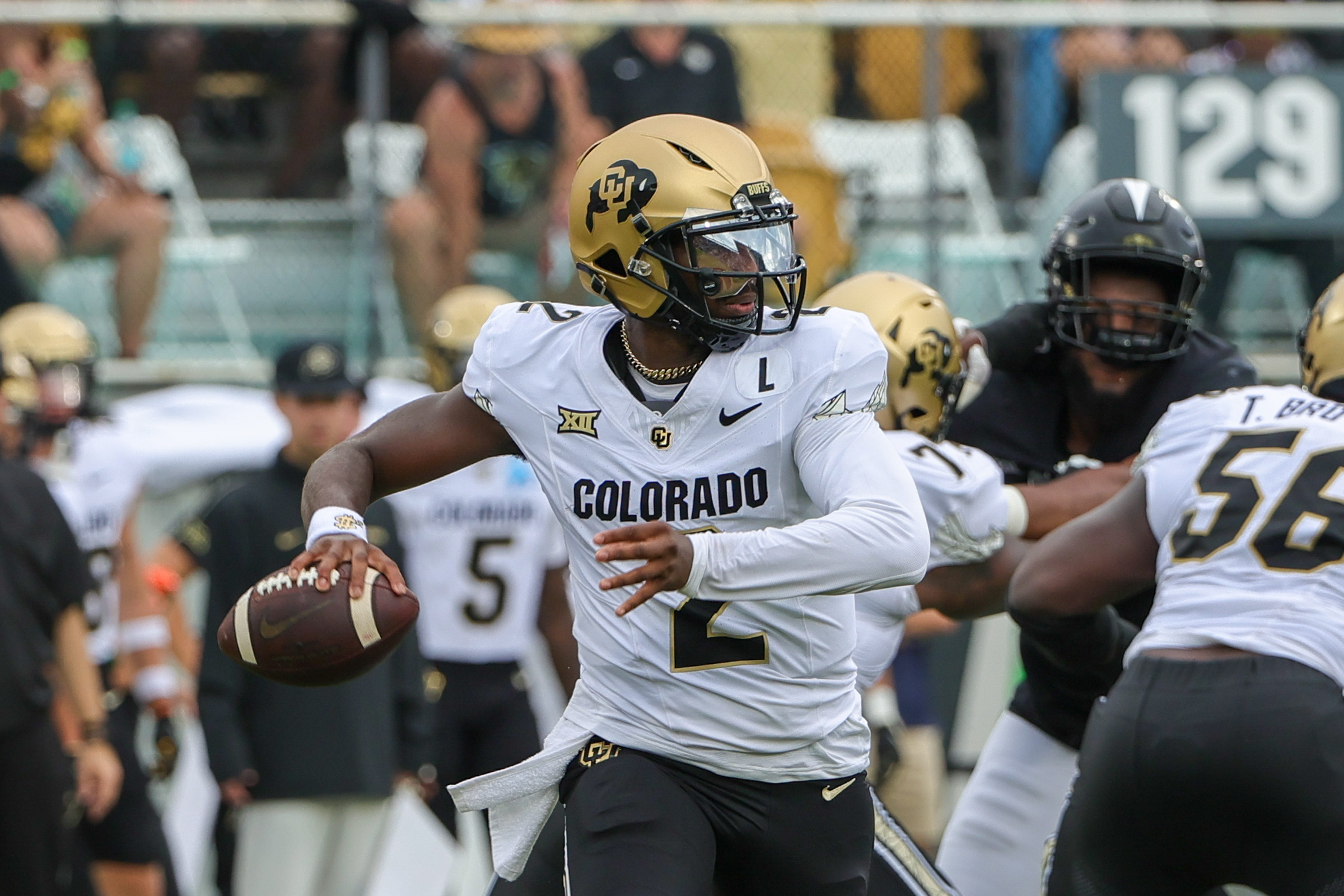 Sep 28, 2024; Orlando, Florida, USA; Colorado Buffaloes quarterback Shedeur Sanders (2) rolls out to pass against the UCF Knights during the first quarter at FBC Mortgage Stadium. Mandatory Credit: Mike Watters-Imagn Images