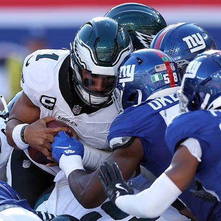EAST RUTHERFORD, NEW JERSEY - OCTOBER 20: Jalen Hurts #1 of the Philadelphia Eagles scores a touchdown against the New York Giants during the fourth quarter at MetLife Stadium on October 20, 2024 in East Rutherford, New Jersey. (Photo by Luke Hales/Getty Images)